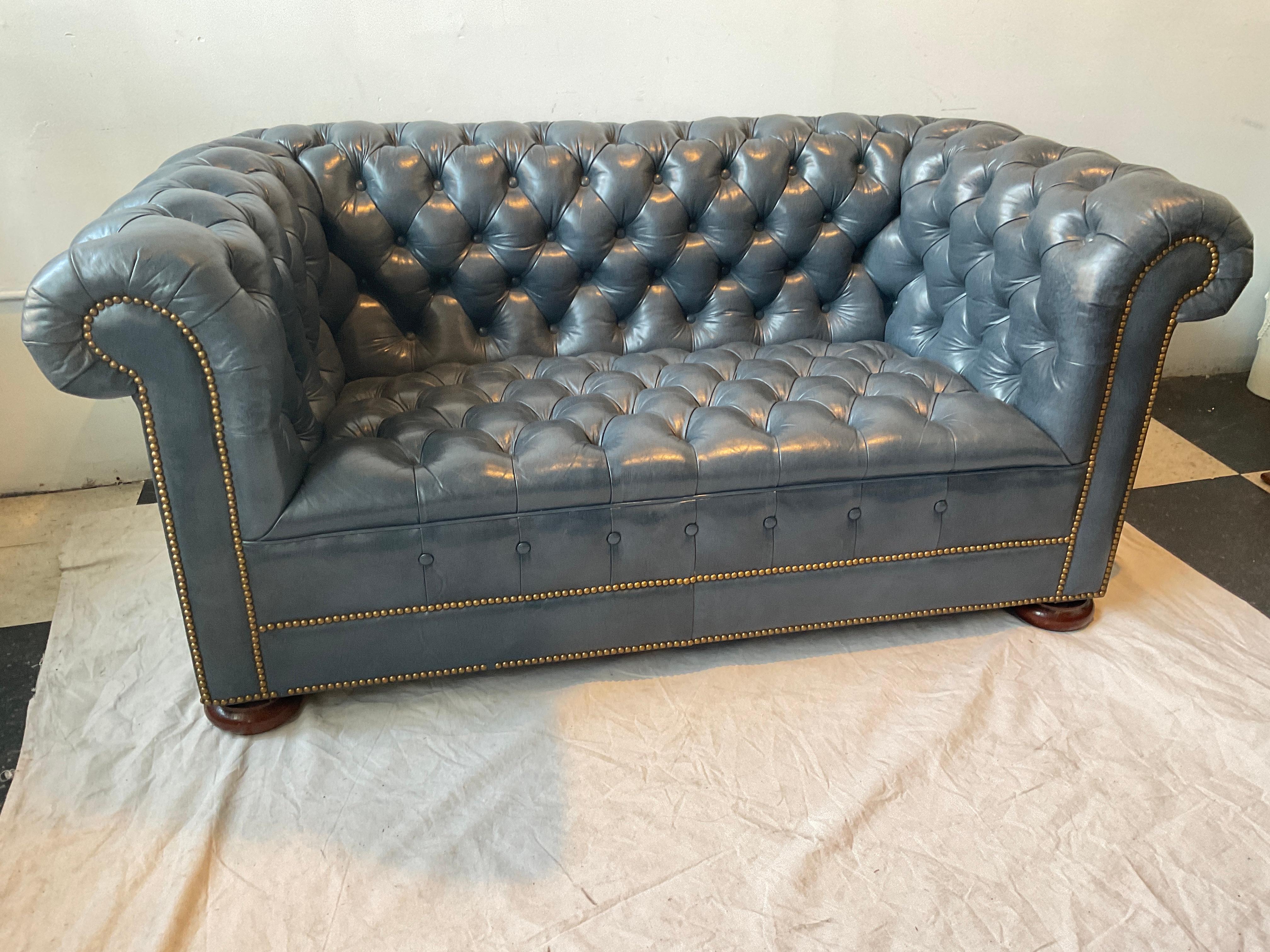 Blue leather chesterfield loveseat by Hickory Chair. Great quality, heavy piece.