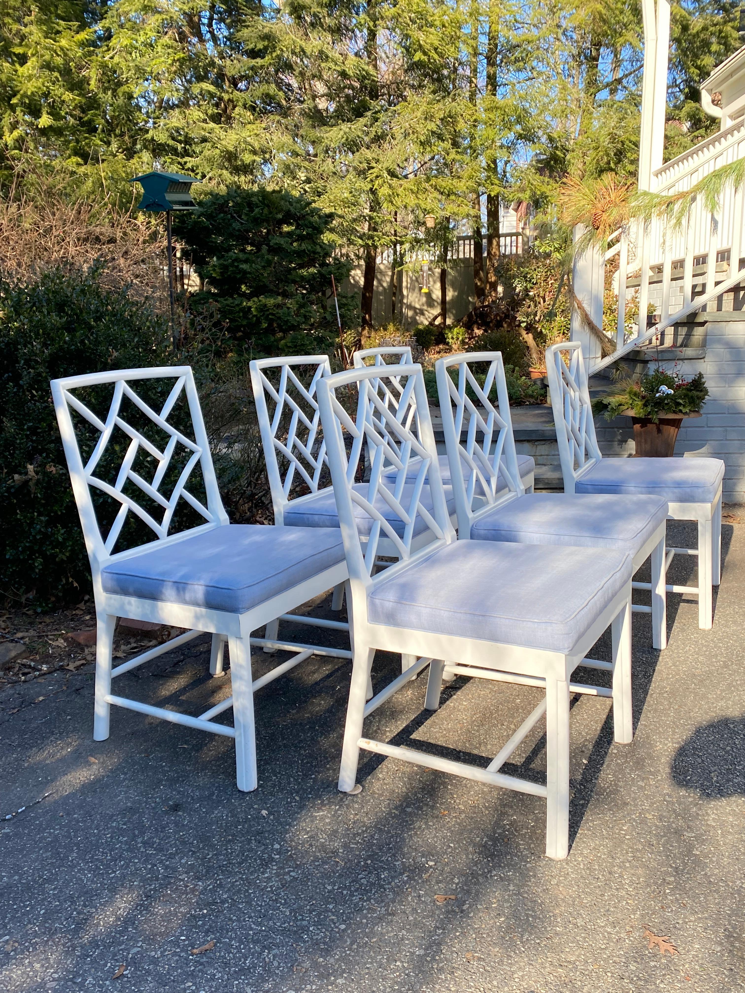 Timeless and stylish Chinoiserie white painted dining chairs by Hickory Chair Company.  Fretwork side chair is part of the James River Collection, crafted from maple in White Finish.  Blue attached cushions easily removed for cleaning or