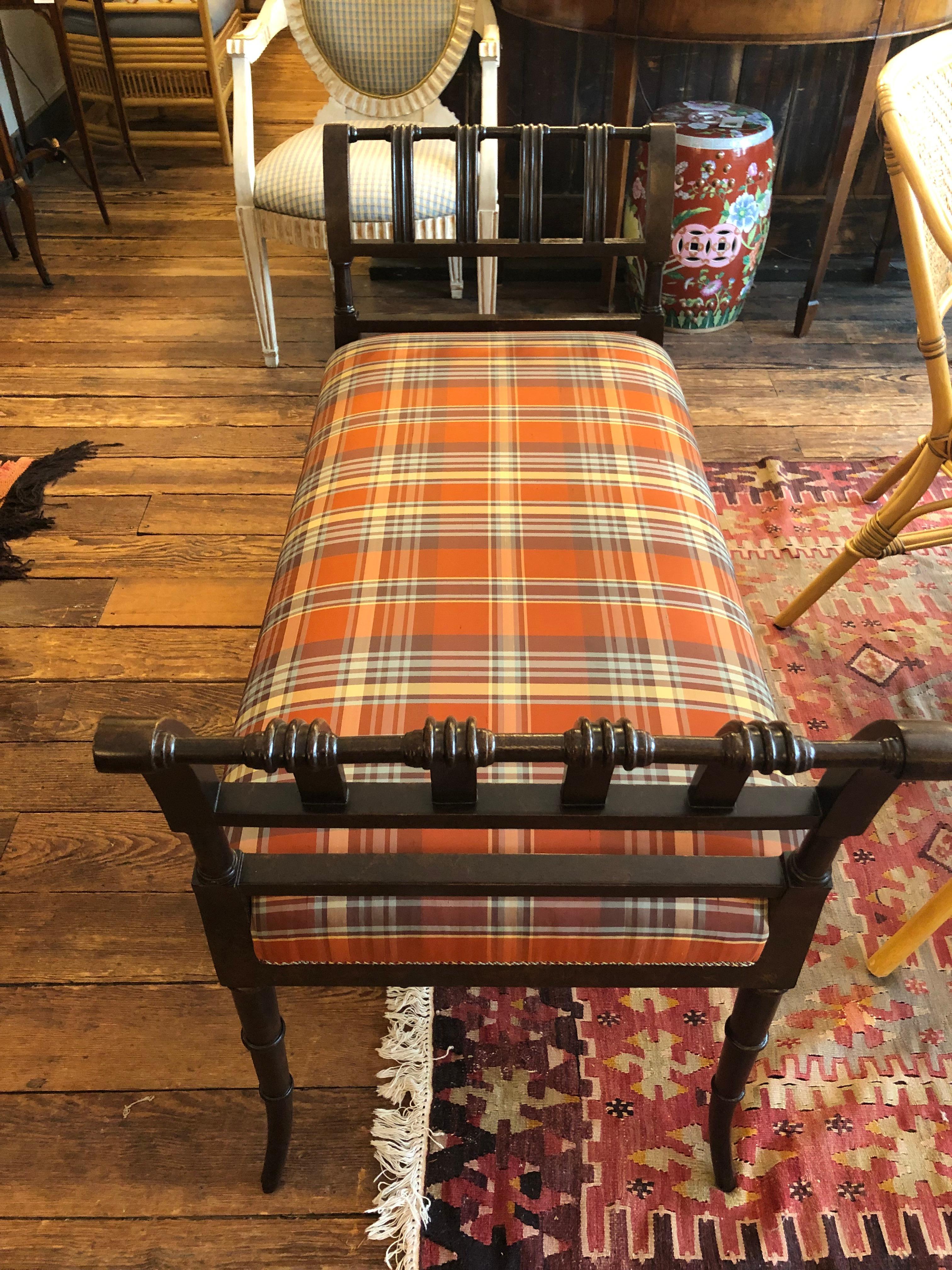 Great looking bench with splayed slatted carved walnut sides and eye catching silk plaid upholstery.
