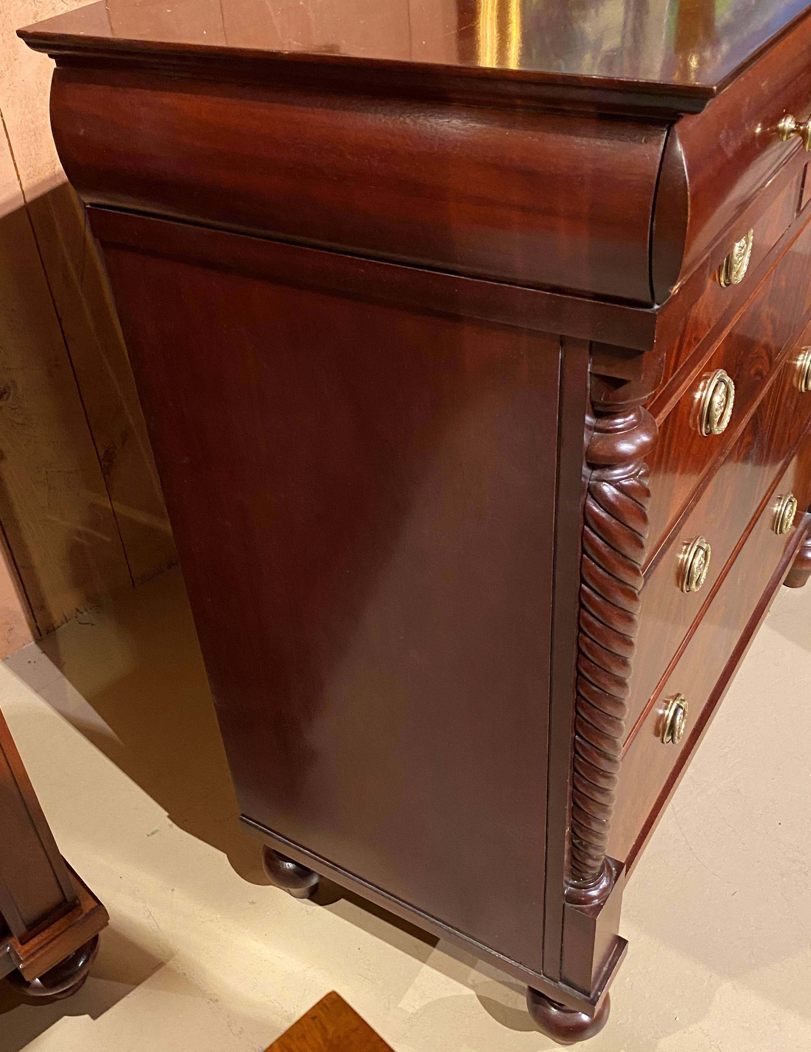 A finely constructed Empire style mahogany six drawer high chest by Hickory Chair, a fine furniture manufacturer since 1911 in Hickory, North Carolina. The chest features a rectangular top surmounting a single top drawer with a two over three