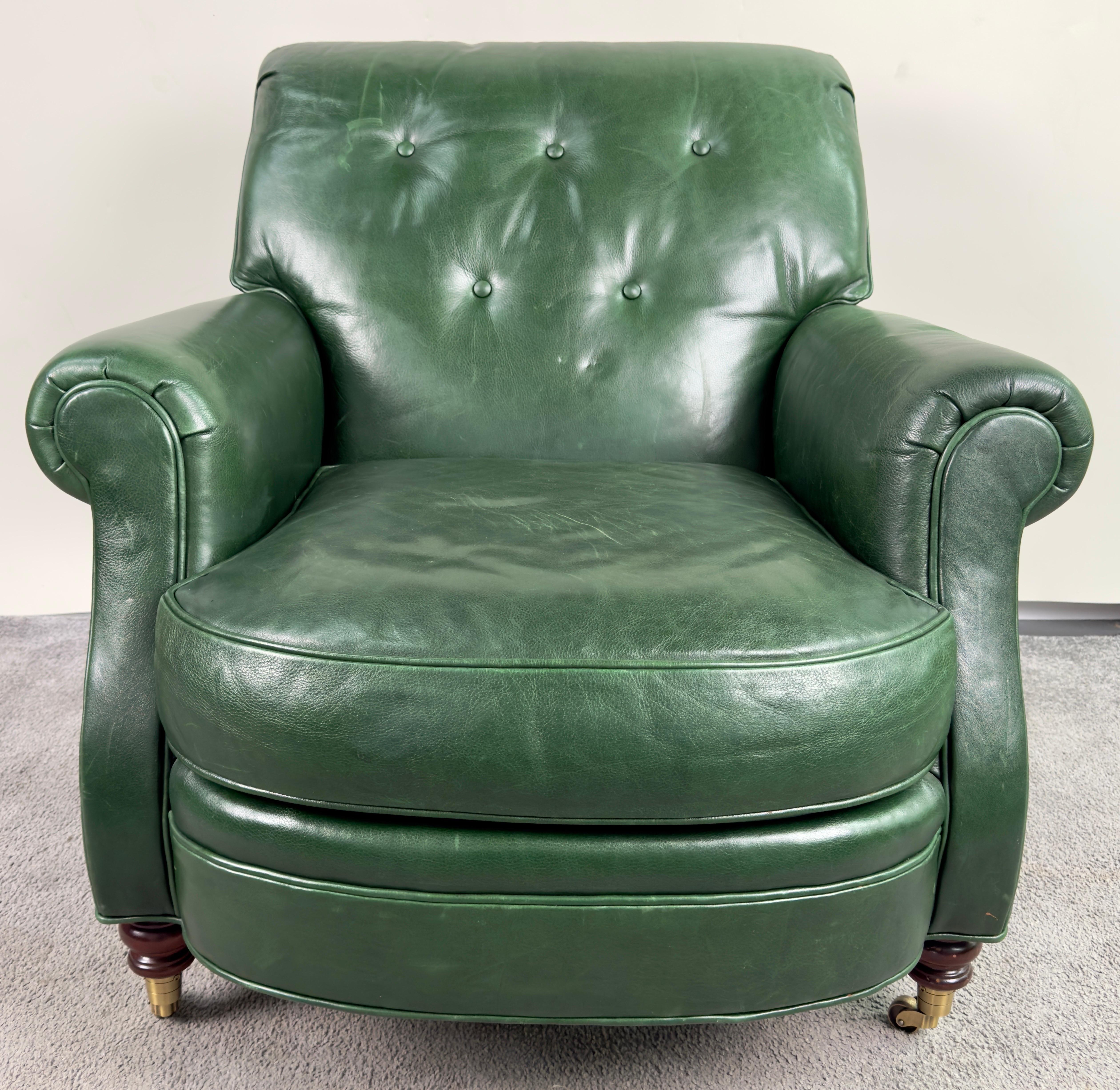 An English style Hickory Club Chair. Crafted in timeless sophistication, this club chair exudes class and comfort. Enveloped in luxurious top-grade green leather upholstery, it boasts a deep, tufted cushion backrest and seat cushion. Embracing you