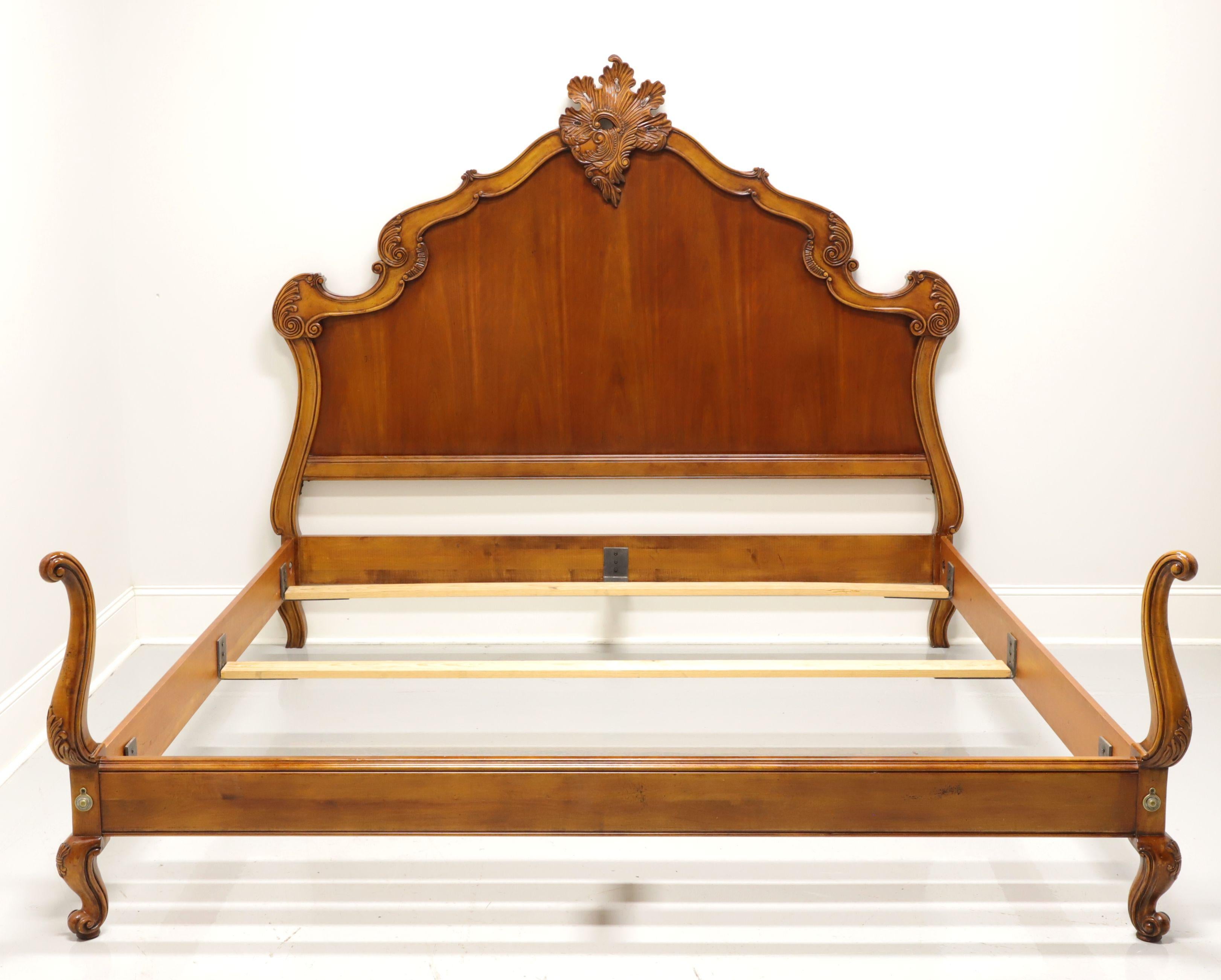 A French Country style king size bed by Hickory Chair, from their French Collection. Decoratively carved solid wood headboard and footboard with their 