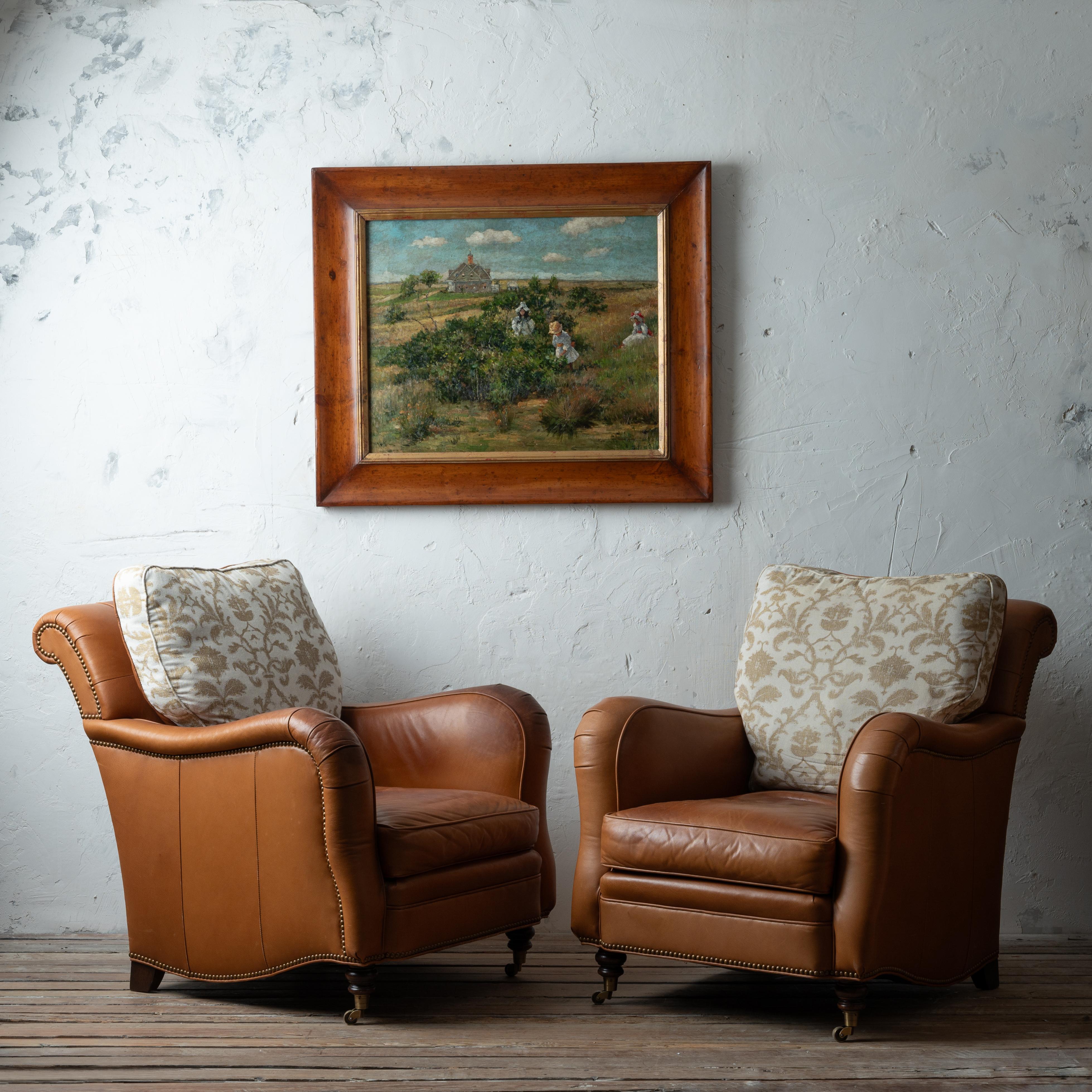 A pair of Lowell leather lounge chairs by Hickory Chair.

33 inches wide by 42 inches deep by 36 inches tall; seat height 18 inches

Good overall with wear, minor scratches and areas of discoloration or patina. 