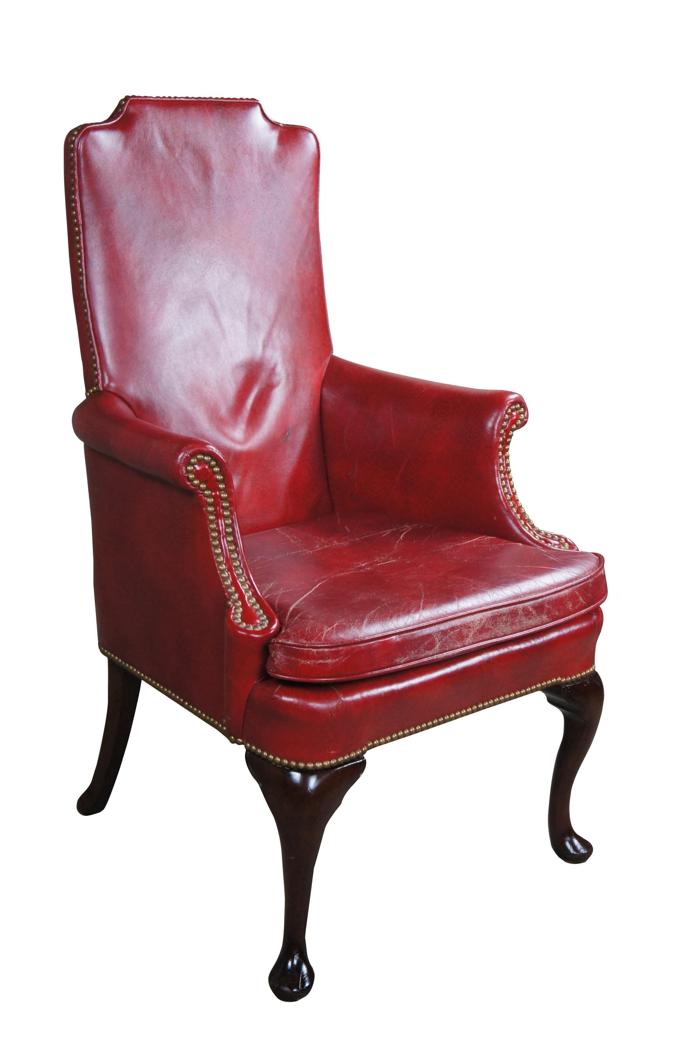 Vintage Hickory Chair red leather library reading or desk armchair featuring Queen Anne styling with high rolled arms, nail head accents and serpentine slipper feet.

Dimensions:
27.5