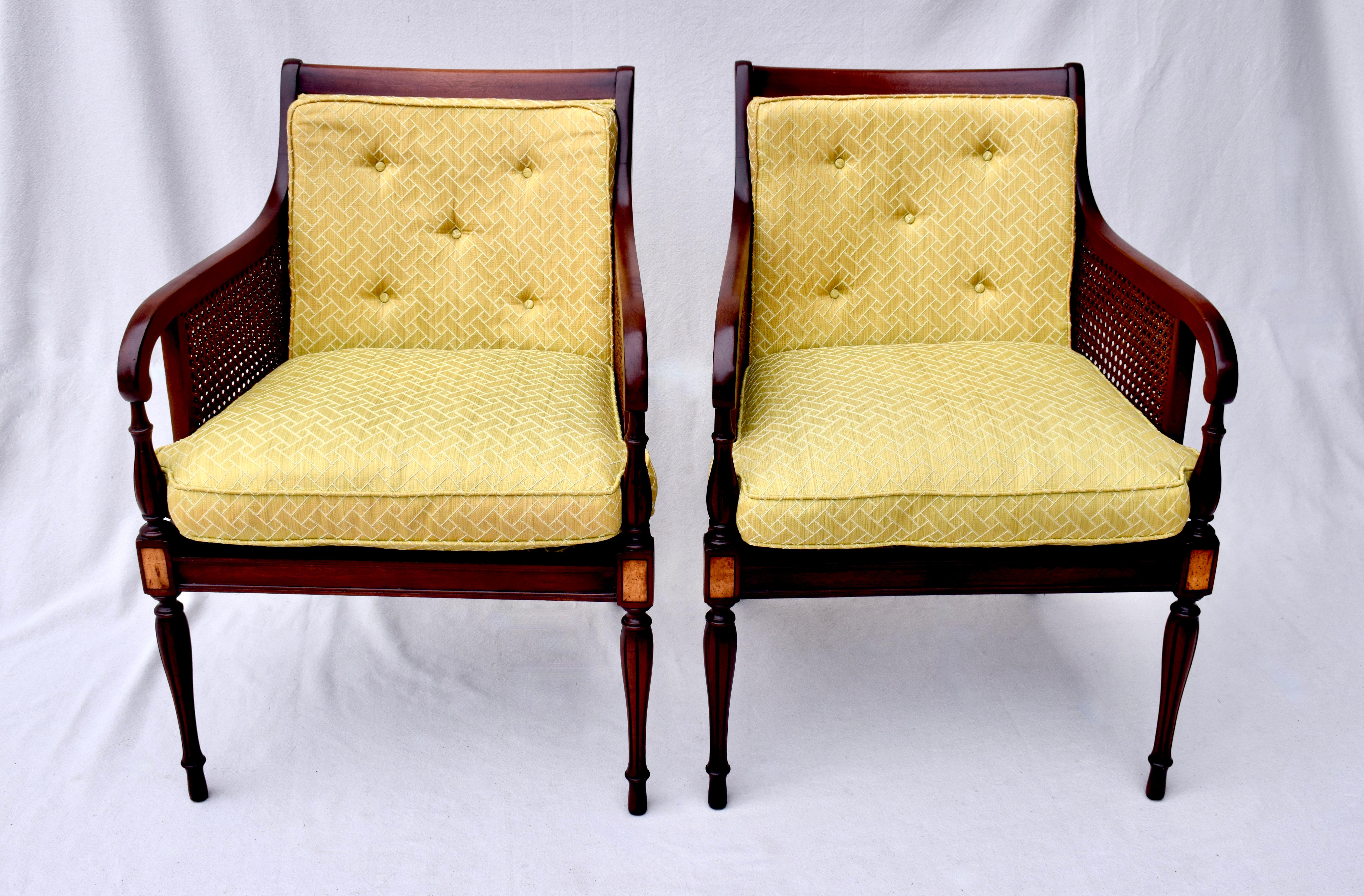 A pair of double caned Mahogany and Satinwood club, lounge or occasional chairs by Hickory Chair with original Scalamandre trellis silk upholstery having new seat inserts with goose down casings. In exceptionally well maintained vintage condition