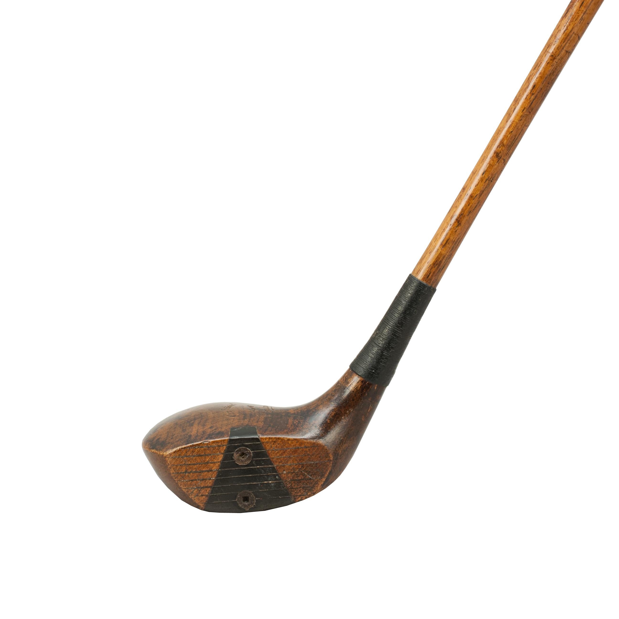 Antique golf club, hickory shafted driver by Alex Patrick of Leven.
A good original persimmon wood socket head brassie with hickory shaft and new leather grip. The head marked 'Alex Patrick, Est. 1847, Leven, Popular'. The club head has lead weight