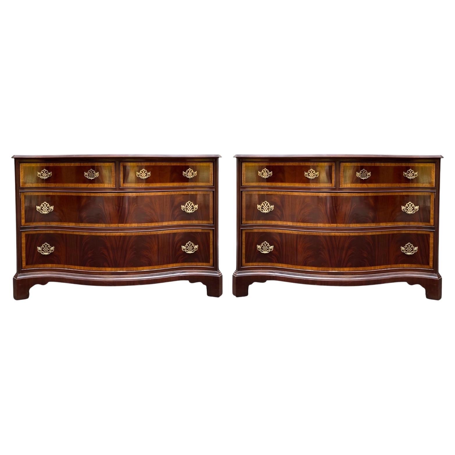 These Chinese Chippendale flame mahogany and satinwood banded serpentine chests are by Hickory Furniture. They have timeless elegance and are in very good condition They are marked.