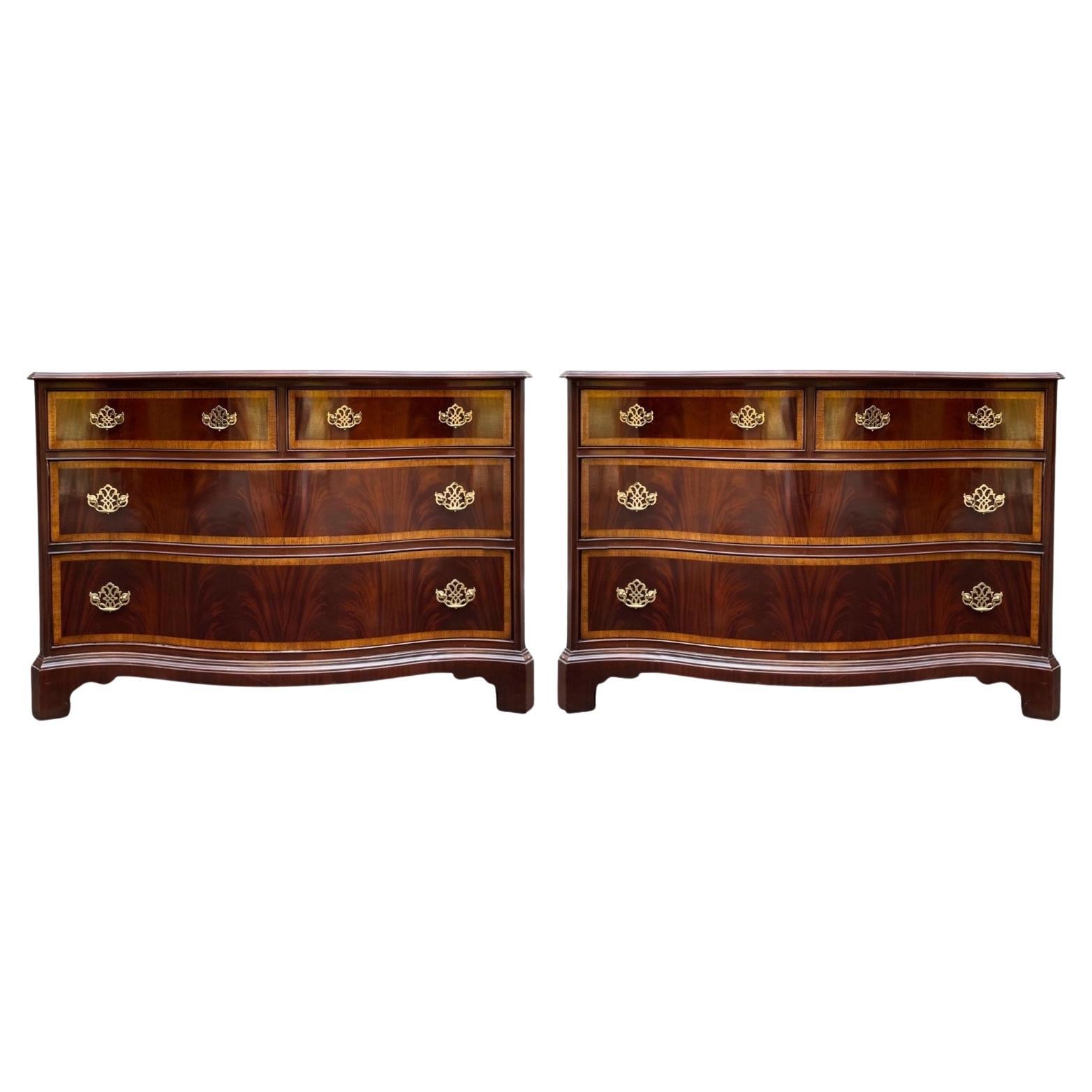 These Chinese Chippendale flame mahogany and satinwood banded serpentine chests are by Hickory Furniture. They have timeless elegance and are in very good condition They are marked.