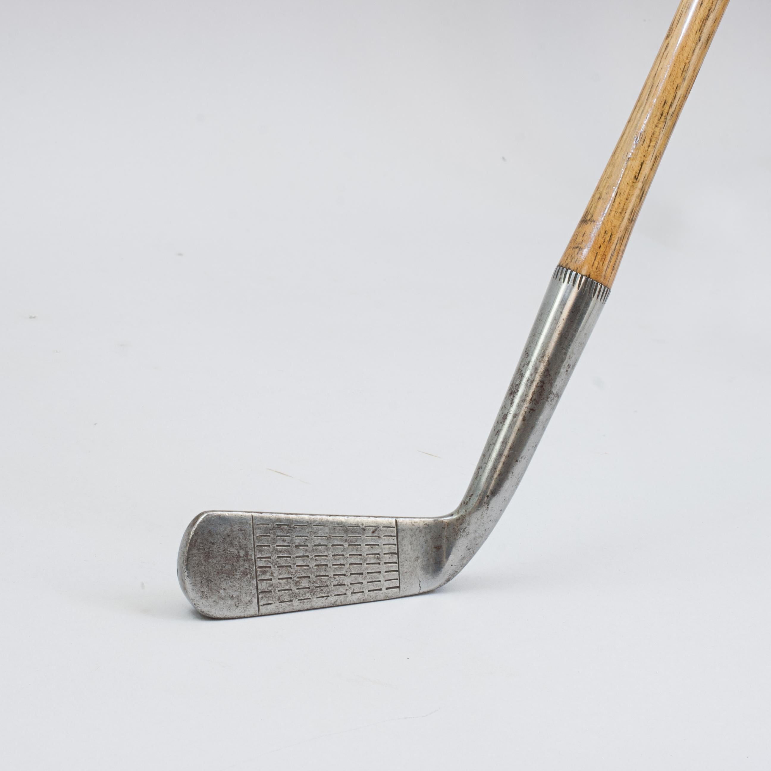 Vintage Gem Putter by Robert Forgan & Son, St Andrews.
A fine playable hickory shafted GEM putter by Robert Forgan & Son of St Andrews. The original hickory shaft with a polished leather grip and stamped with Forgan's details just below the grip.