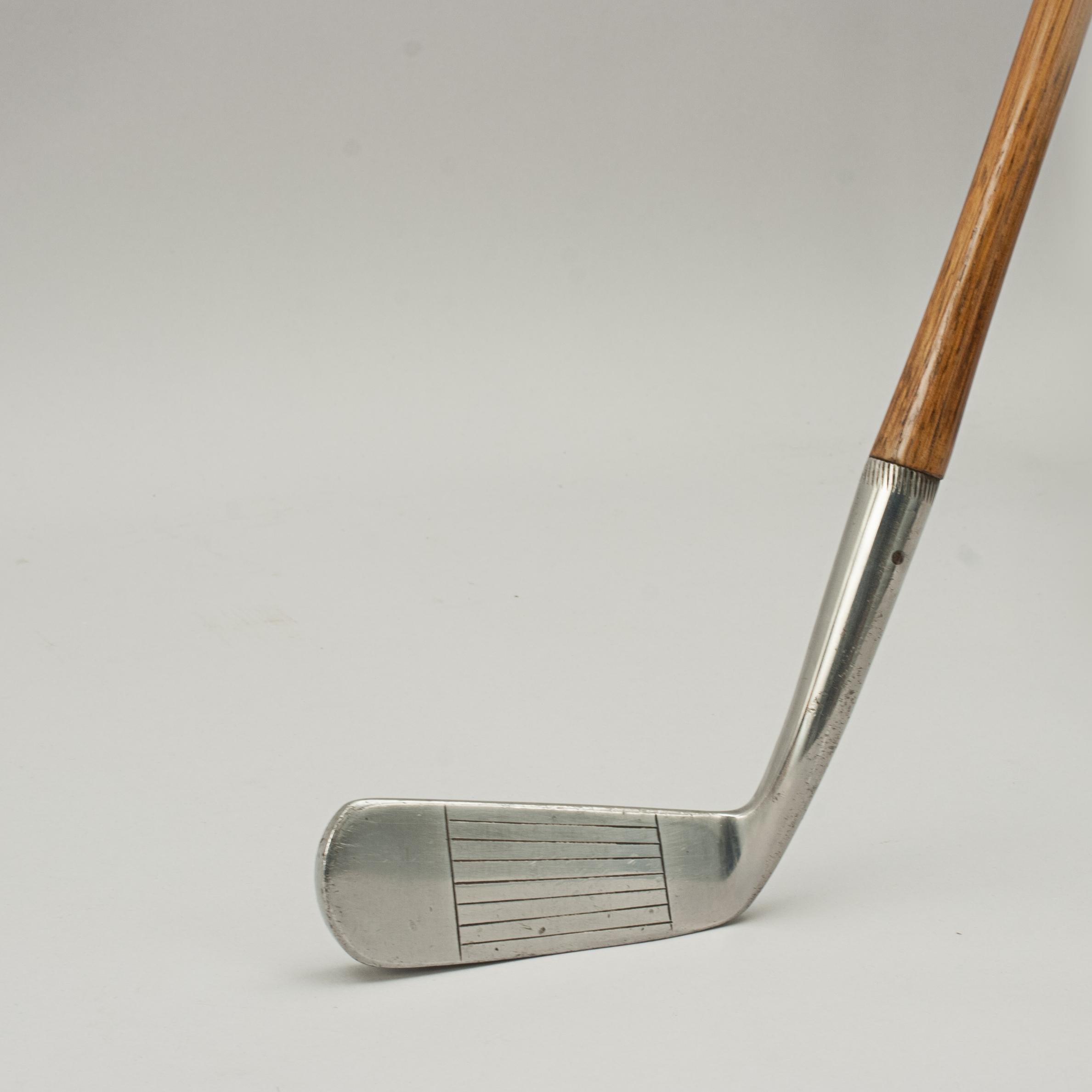 Vintage Hickory Golf Club, Wry Neck Putter, Spalding.
A fine and nicely weighted line faced offset putter, wryneck putter by A.G. Spalding & Bros. The hickory shaft with polished leather grip, the rear of the club head marked 'A.G. Spalding &