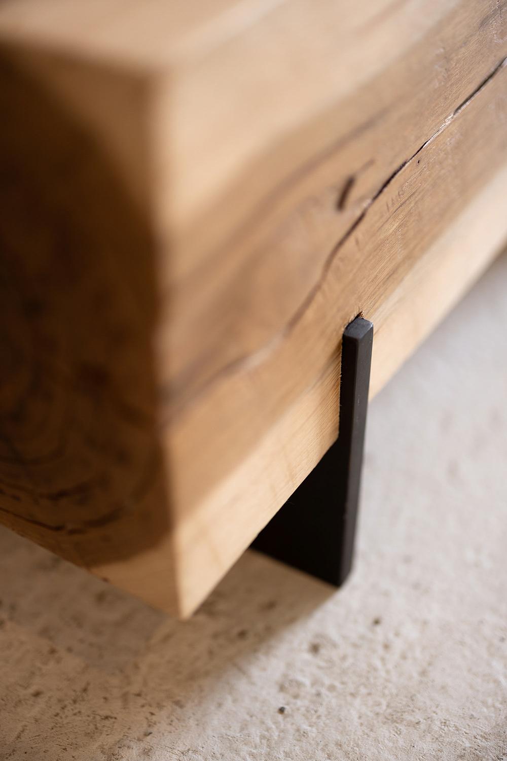 Our knife beam bench in hickory utilizes salvaged walnut wood logs for a rustic bench. Narrow and backless, the simple lines express the natural texture of the end grain of each species. The 12