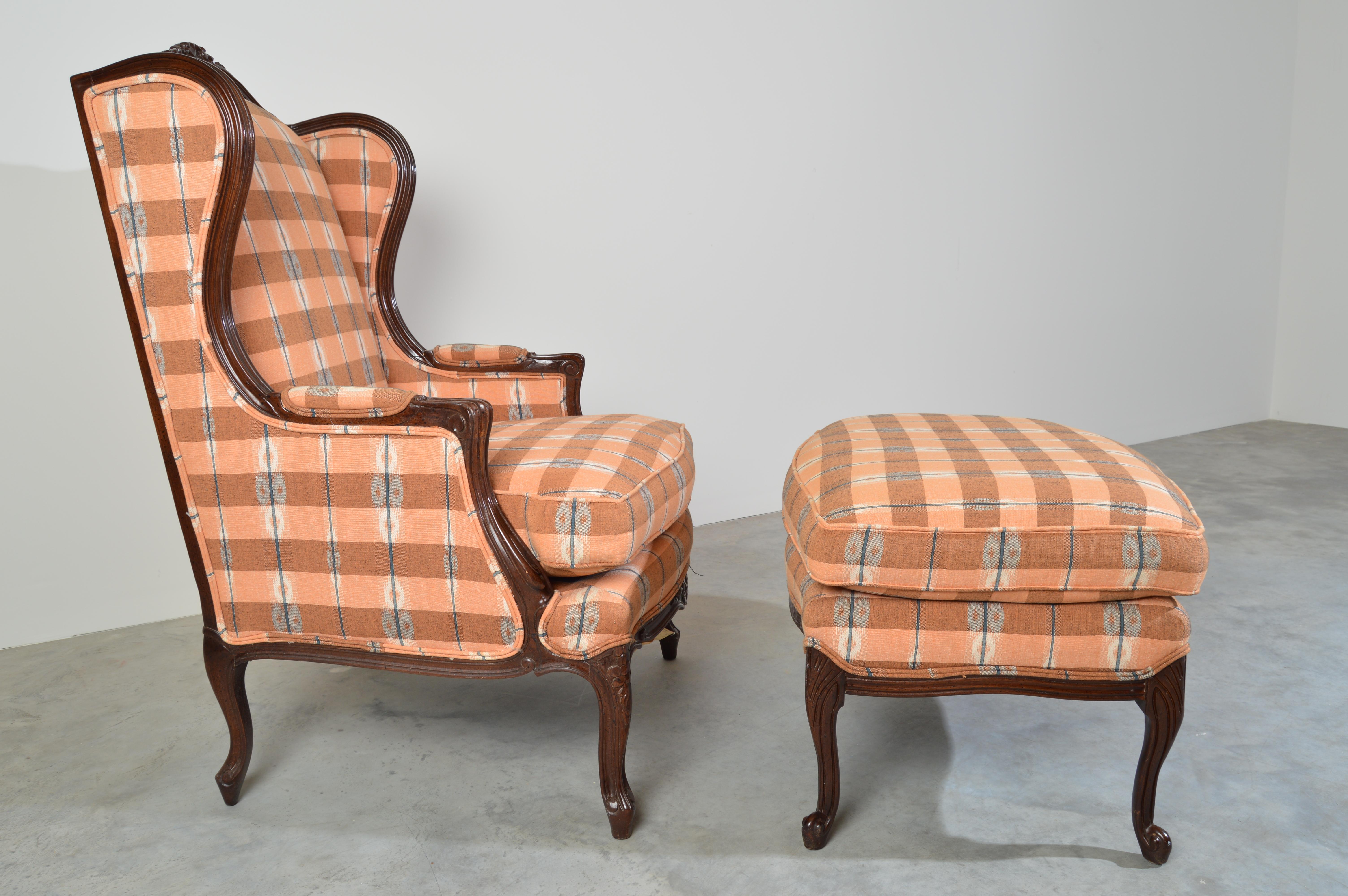 Hickory chair Company Louis XV style walnut wingback chair and ottoman having Pendleton style Ikat plaid upholstery. Classical French Louis XV style wingback chair and ottoman by Hickory Chair Company. The chair features beautifully carved hardwood