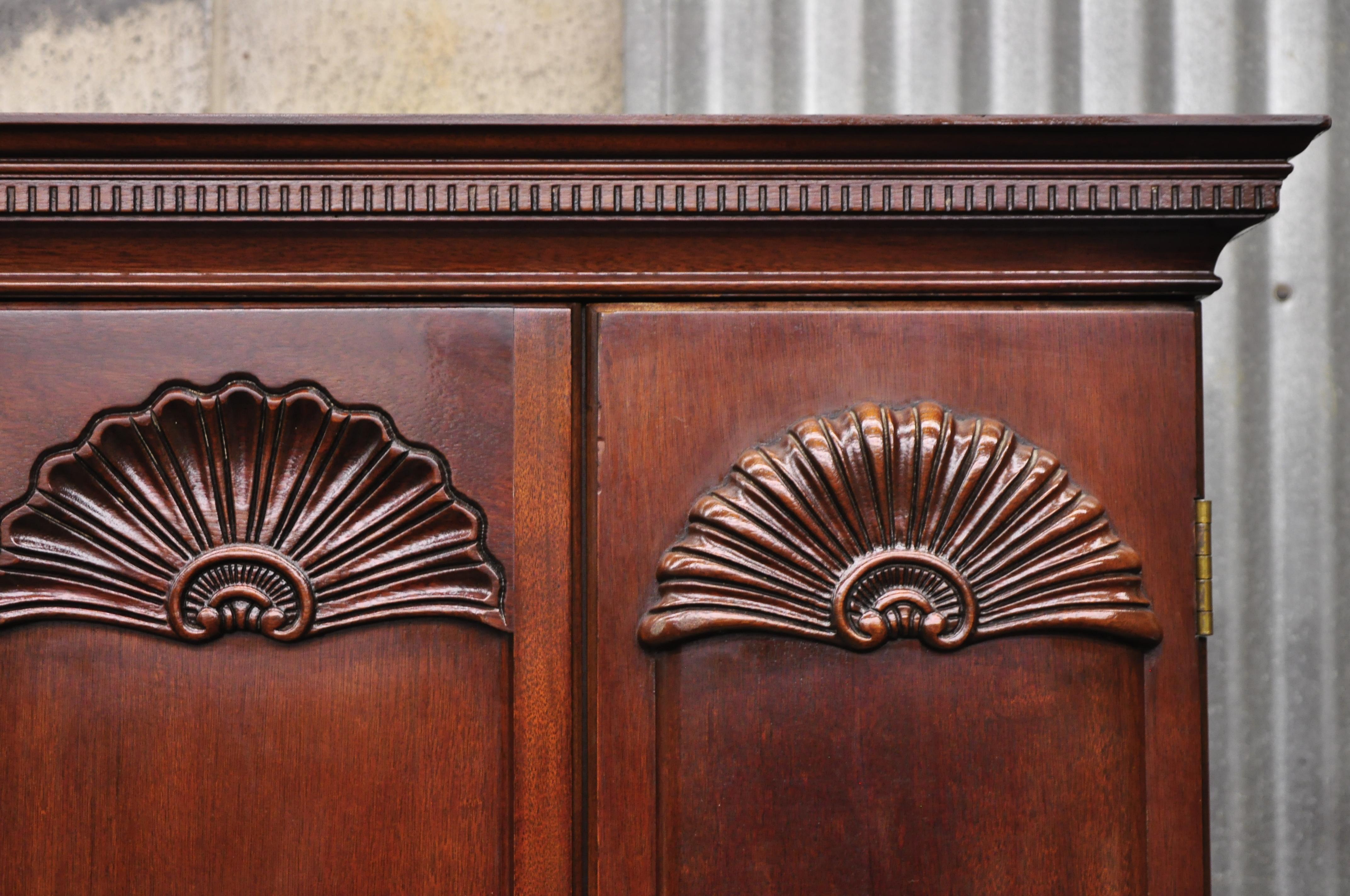 Hickory Mfg. Masterpiece Collection mahogany Georgian Chippendale blockfront Armoire cabinet chest. Item features blockfront shell carved details, removable adjustable wooden shelves, solid wood construction, beautiful wood grain, nicely carved