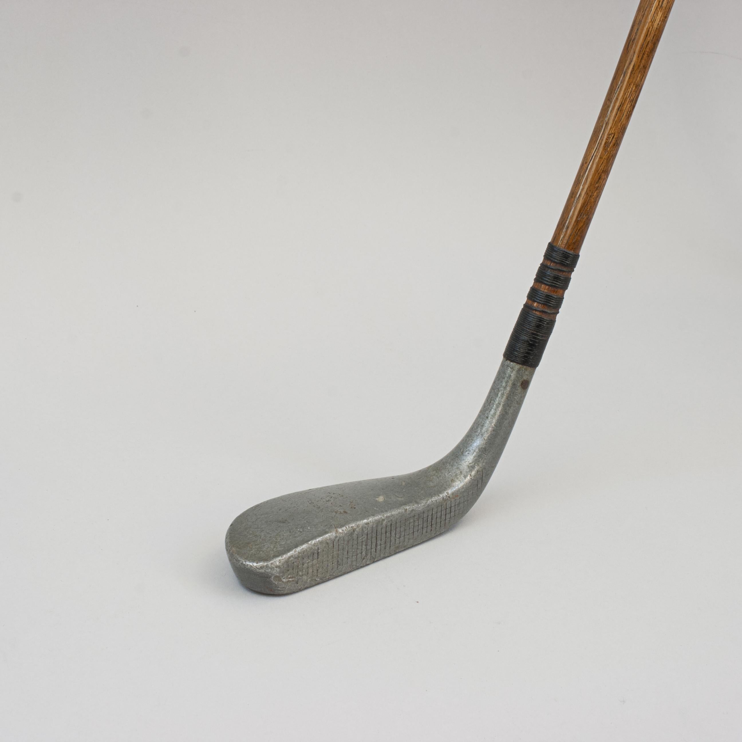 Vintage Hickory Golf Club, Braid Mills Long Nose Putter.
A good example of an aluminium long nose Braid Mills putter by the Standard Golf Co. The top of the head is stamped 'STANDARD GOLF Co., MILLS 2062, PATENT, SUNDERLAND', whilst the underside is