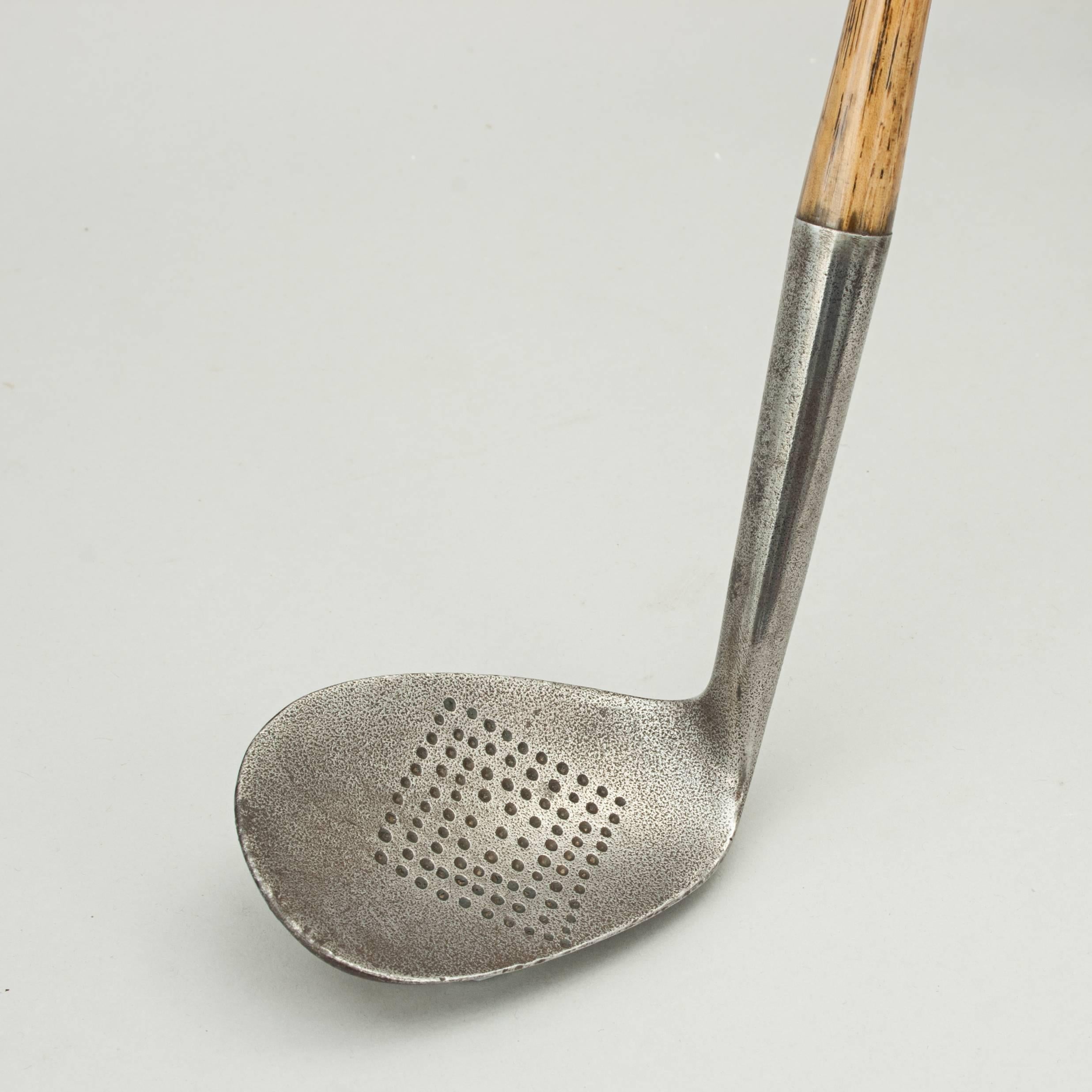 Hickory Shafted Niblick.
A good quality dish faced niblick golf club with hickory shaft. The head stamped on the back ' special Niblick' warranted hand-forged with a 'crossed clubs' cleek mark (hard to tell but possibly 'SJ Preve' across the cleek