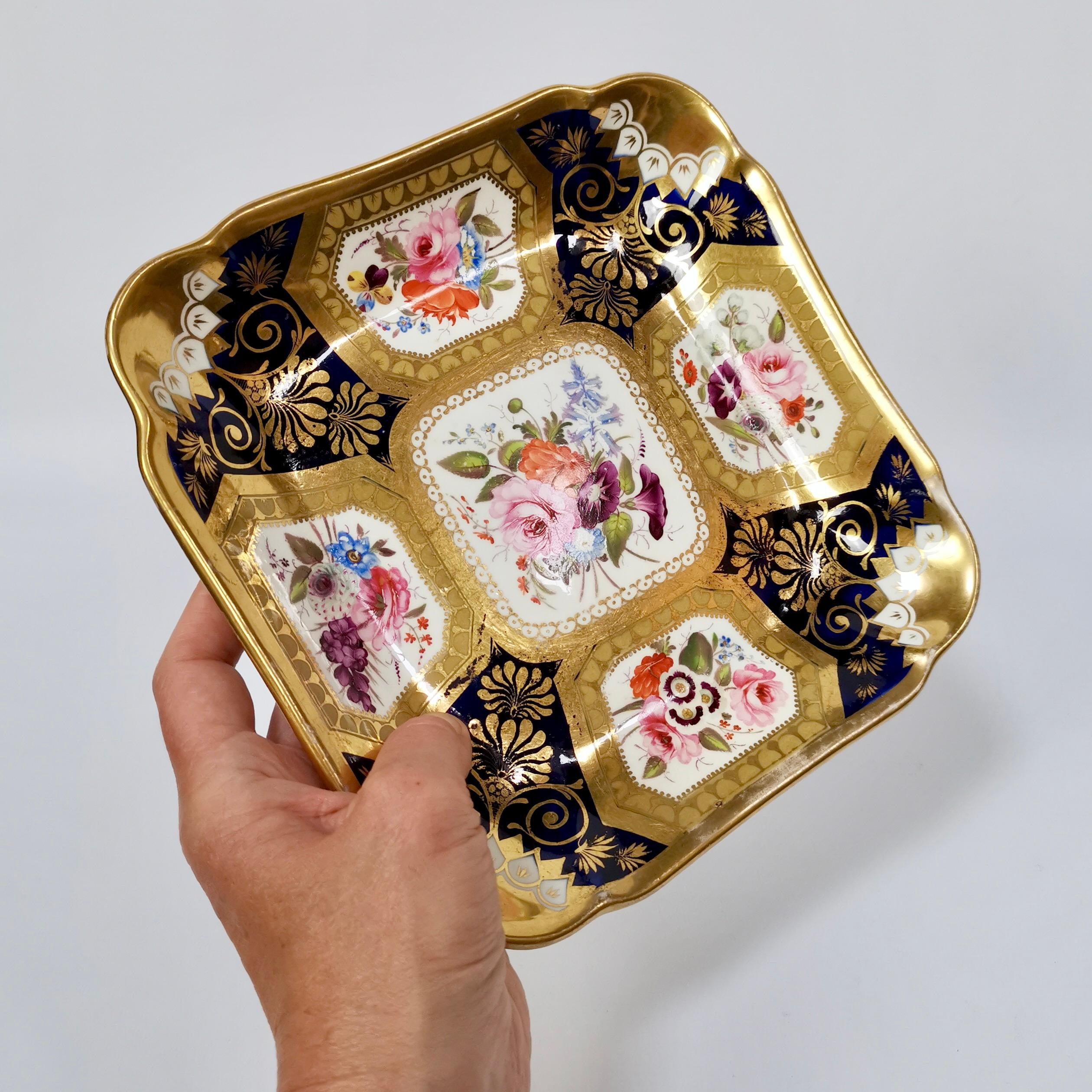 This is a beautiful square dessert dish made by Hicks & Meigh in about 1820. The dish has a deep cobalt blue ground, lavish gilding and panels with beautiful hand painted flowers.

Hicks & Meigh was one of the many china factories in early 19th