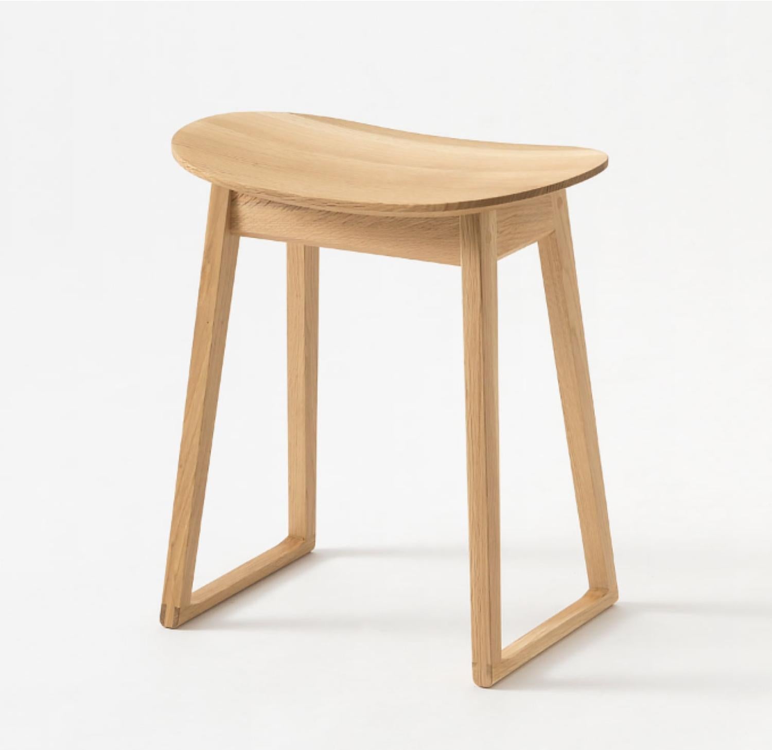 A truly beautiful hand crafted solid oak Stool by HIDA Japan.  The Suwari series is designed with an awareness of vertical flow, blending naturally into both Japanese and modern architectural spaces, and enhancing them.
The weighted design and form