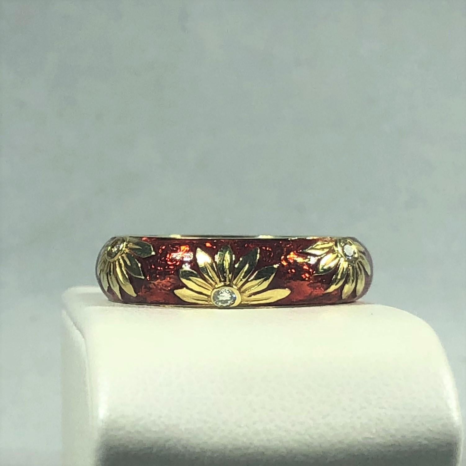 Hidalgo 18 Karat Enamel and Diamond Sunflower Stacking Ring. This Hidalgo piece s created I 18 karat yellow gold, weight 7.8 grams. A beautiful design of  engraved guilloche' and red enamel on half shank and bright polish gold on half shank. There