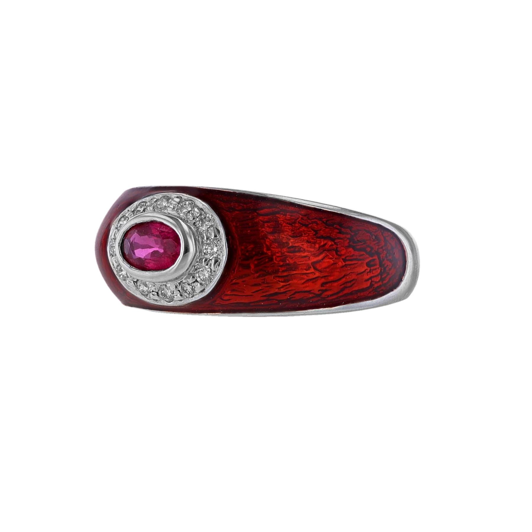 This ring is made in 18K white gold and red enamel. It features a center oval shape ruby, 3x5mm. Along with 12 round cut diamonds weighing 0.12ct.