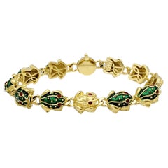 Hidalgo 18 Karat Yellow Gold 3D 11 Frog Link Bracelet with Green & Red Enamel 