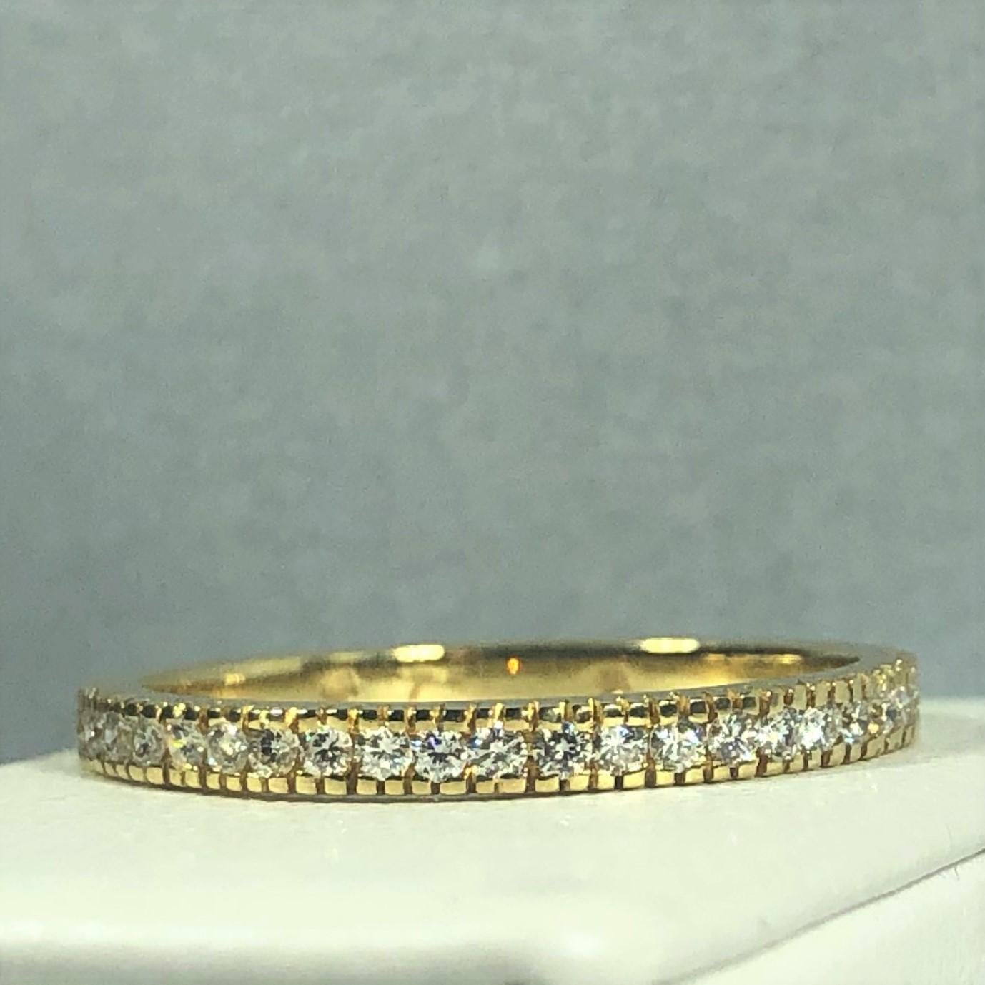Hidalgo 18 Karat Yellow Gold and Diamond half shank eternity  Band.This Hidalgo creation is created in 18 karat yellow gold, weight- 2.1 grams. The piece is adorned with 23 round cut diamonds total carat weight- .23 carats, color- G-H, clarity- VS1.