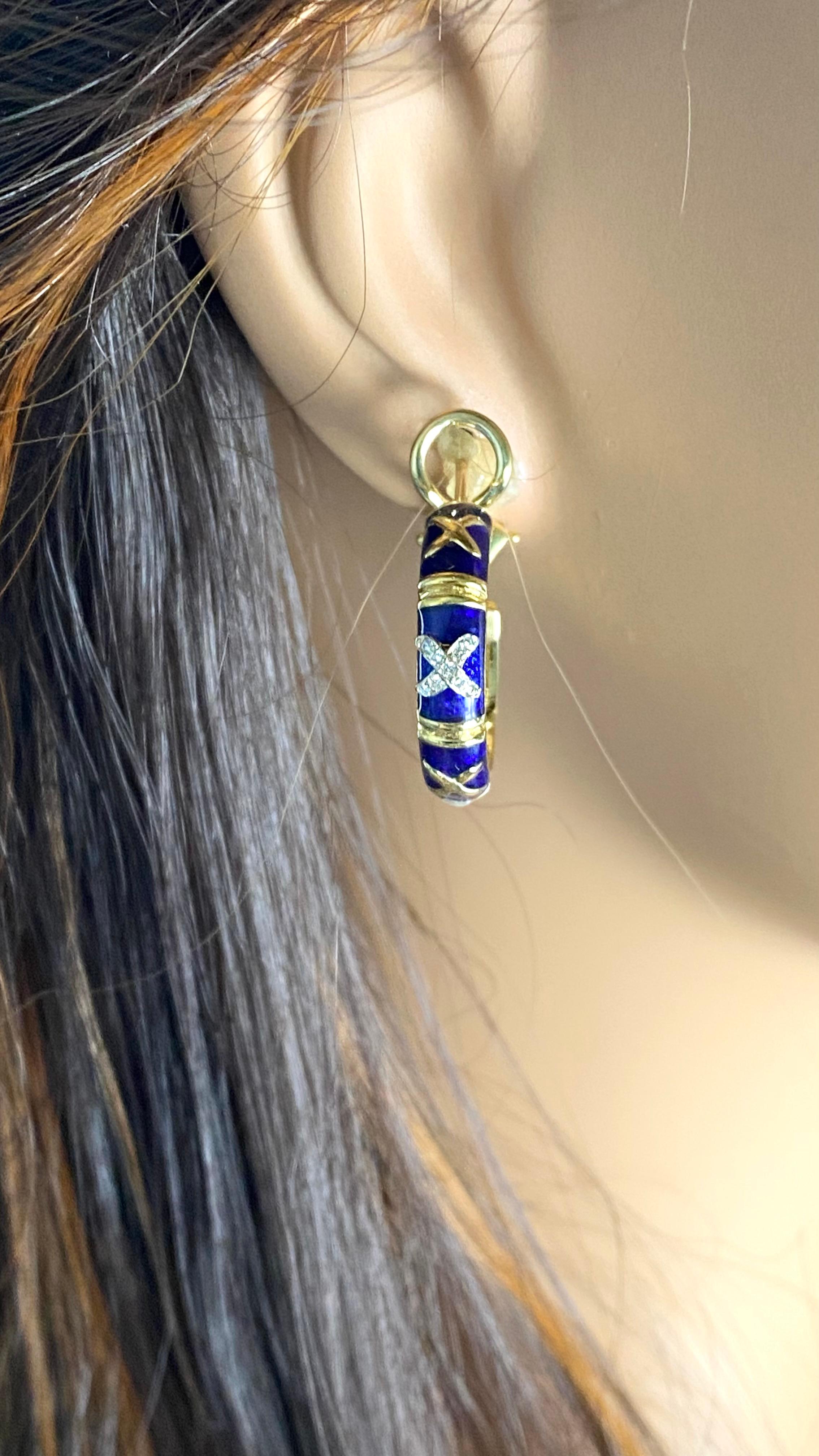 Add a touch of elegance and sophistication to your jewelry collection with these exquisite Hidalgo 18K Gold Diamond Enamel Hoop Earrings. Crafted from luxurious 18k yellow gold, these stunning earrings feature a seamless blend of diamonds and enamel