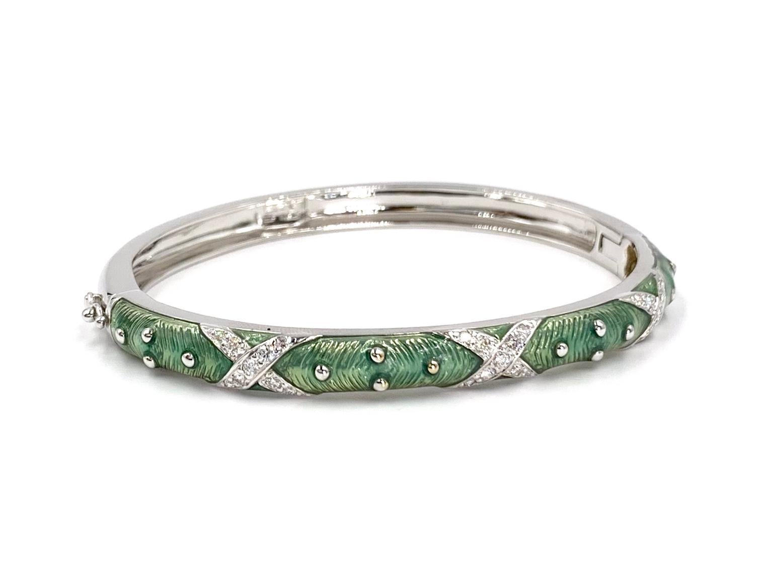 Made by expert fine enamel jewelry designer, HIDALGO. This 18 karat white gold 6mm wide bangle bracelet features a truly unique shade of opalescent light green enamel that appears to shimmer and .46 carats of round brilliant white diamonds at
