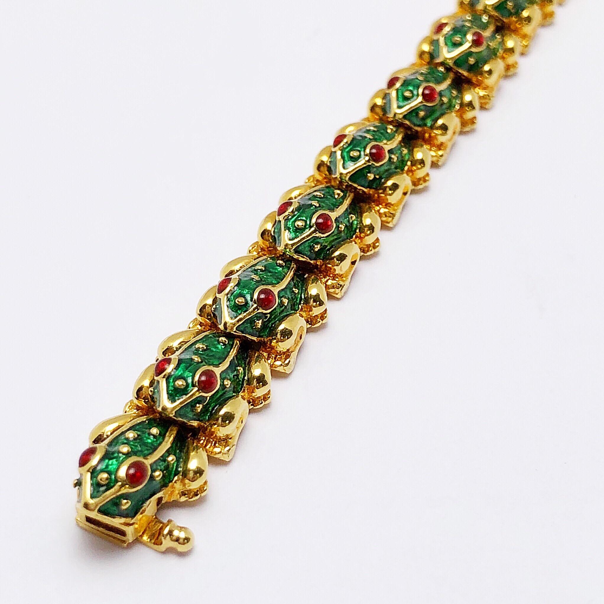 Crafted in true Hidalgo style this bracelet is designed with 17 interconnected frogs, making this line bracelet flexible. Each frog has been meticulously enameled in a vibrant green and set with cabachon ruby eyes. The bracelet measures 7.5