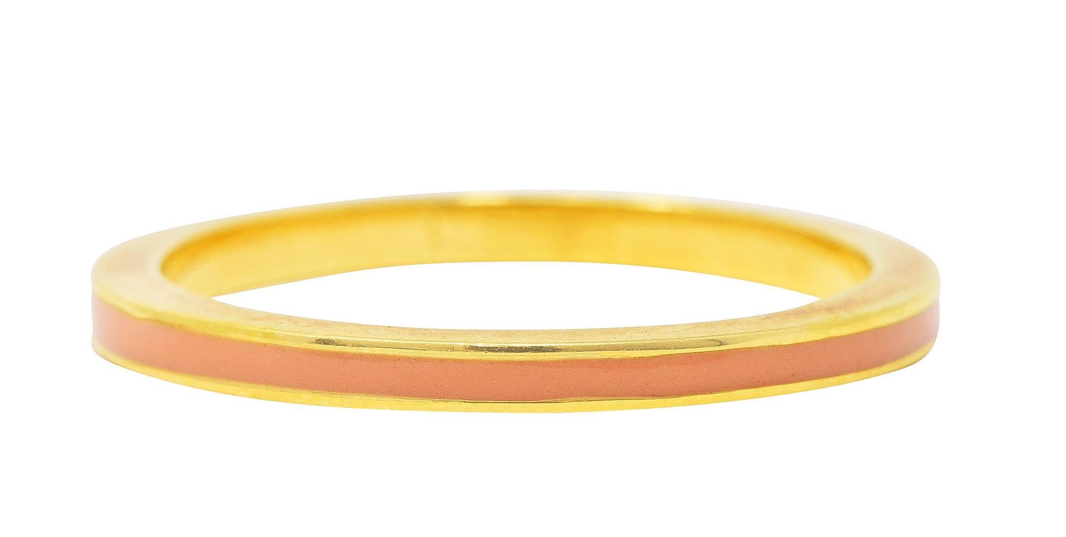 Band ring features a recessed enamel channel fully around
Glossy and opaque light peach in color
With high polished gold surround
Stamped 750 for 18 karat gold
Fully signed with maker's mark for Hidalgo
Circa: 1990's
Ring size: 6 1/2 and not