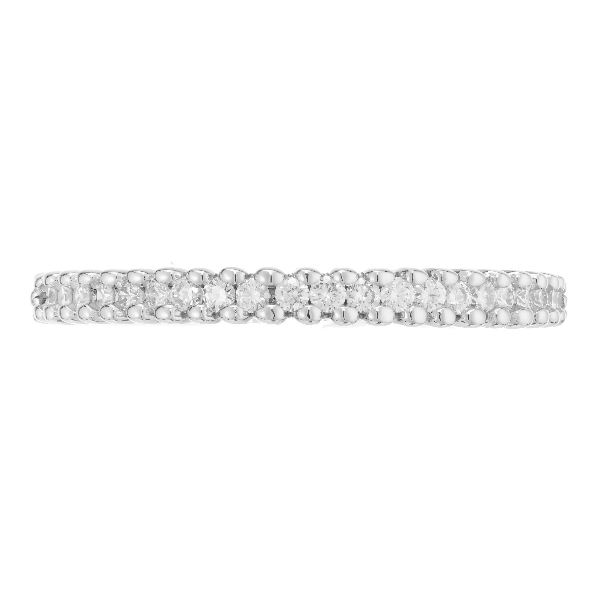 Hildago 18k white gold wedding band with .30cts of brilliant cut diamonds

21 round brillinat cut diamonds, G-H VS approx. .30cts
Size 6.25 and sizable
18k white gold
Stamped: 750
Hallmark: Hidalago
2.3 grams
Width at top: 2.2mm
Height at top: