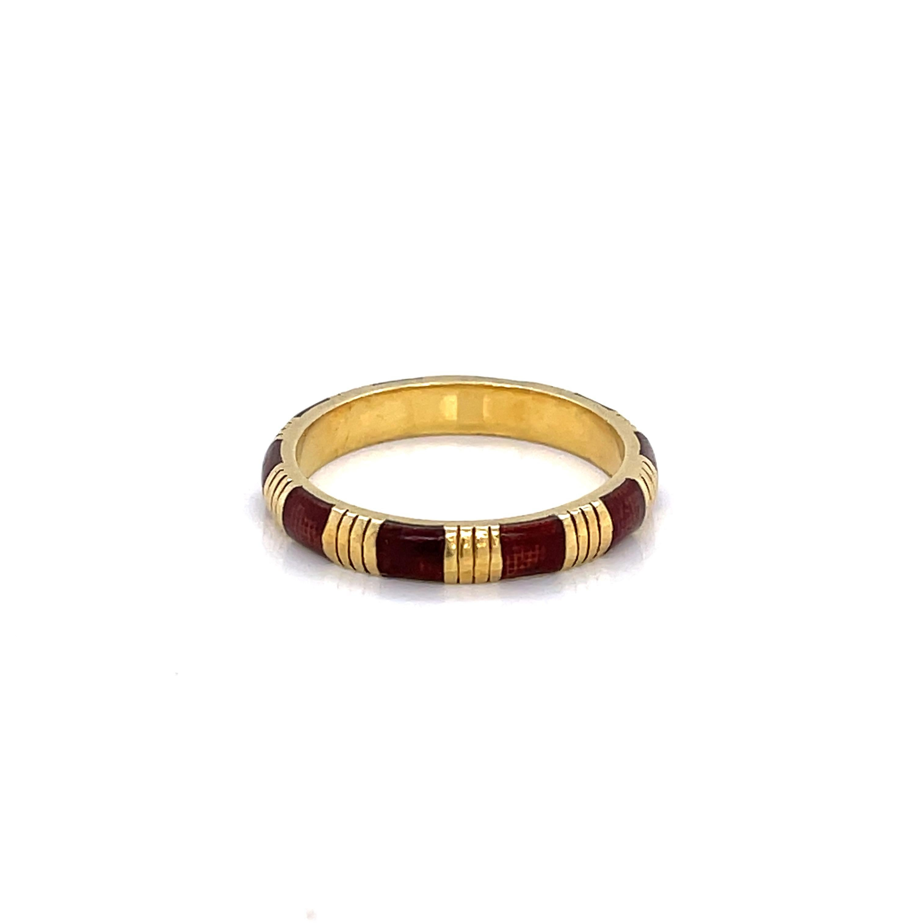 Hand painted accents of deep red enamel alternating with gold bars enhance this eighteen karat 18K yellow gold 3mm stacking band. In ring size 6 by Hidalgo. Gift Boxed.