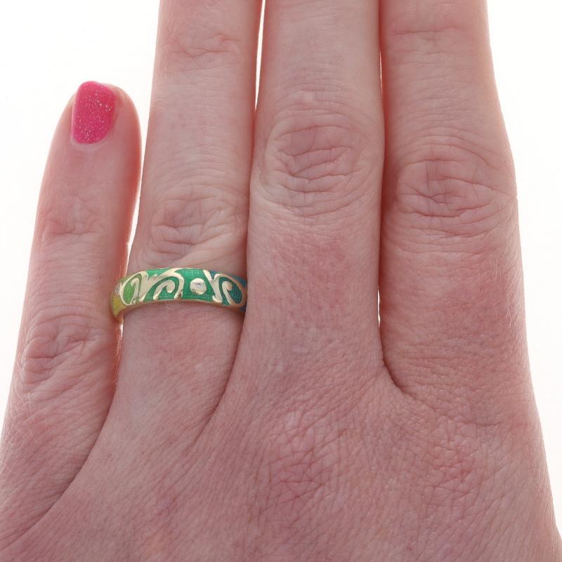 Size: 6 3/4

Brand: Hidalgo

Metal Content: 18k Yellow Gold

Stone Information

Natural Diamonds
Carat(s): .04ctw
Cut: Round Brilliant
Color: G - H
Clarity: SI1 - SI2

Style: Eternity Band
Theme: Swirl
Features: Enamel Detailing

Measurements

Face