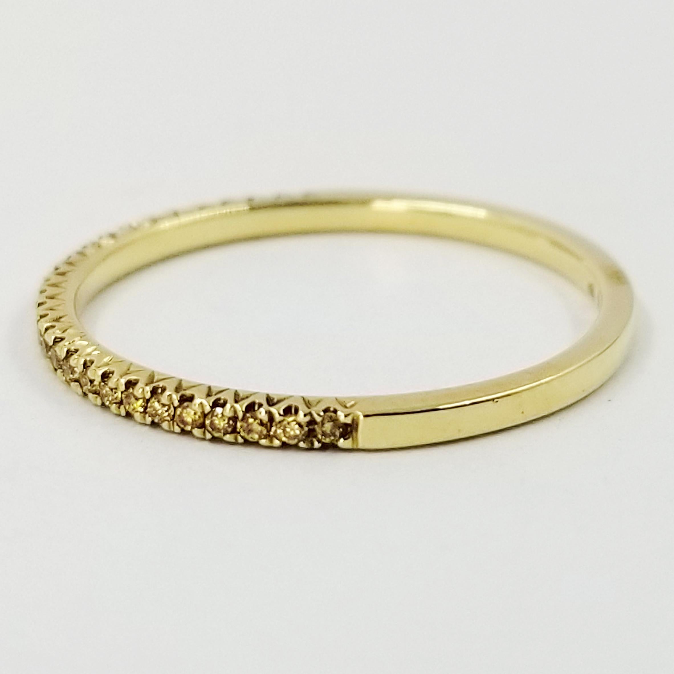 18 Karat Yellow Gold Ring From Hidalgo Featuring 28 Round Yellow Diamonds. Each Diamond Is Set With 4 Prongs, Extending Half Way Around The Ring. Total Diamond Weight is 0.12 Carats. Current Finger Size is 6.5; Purchase Includes One Free Sizing Up