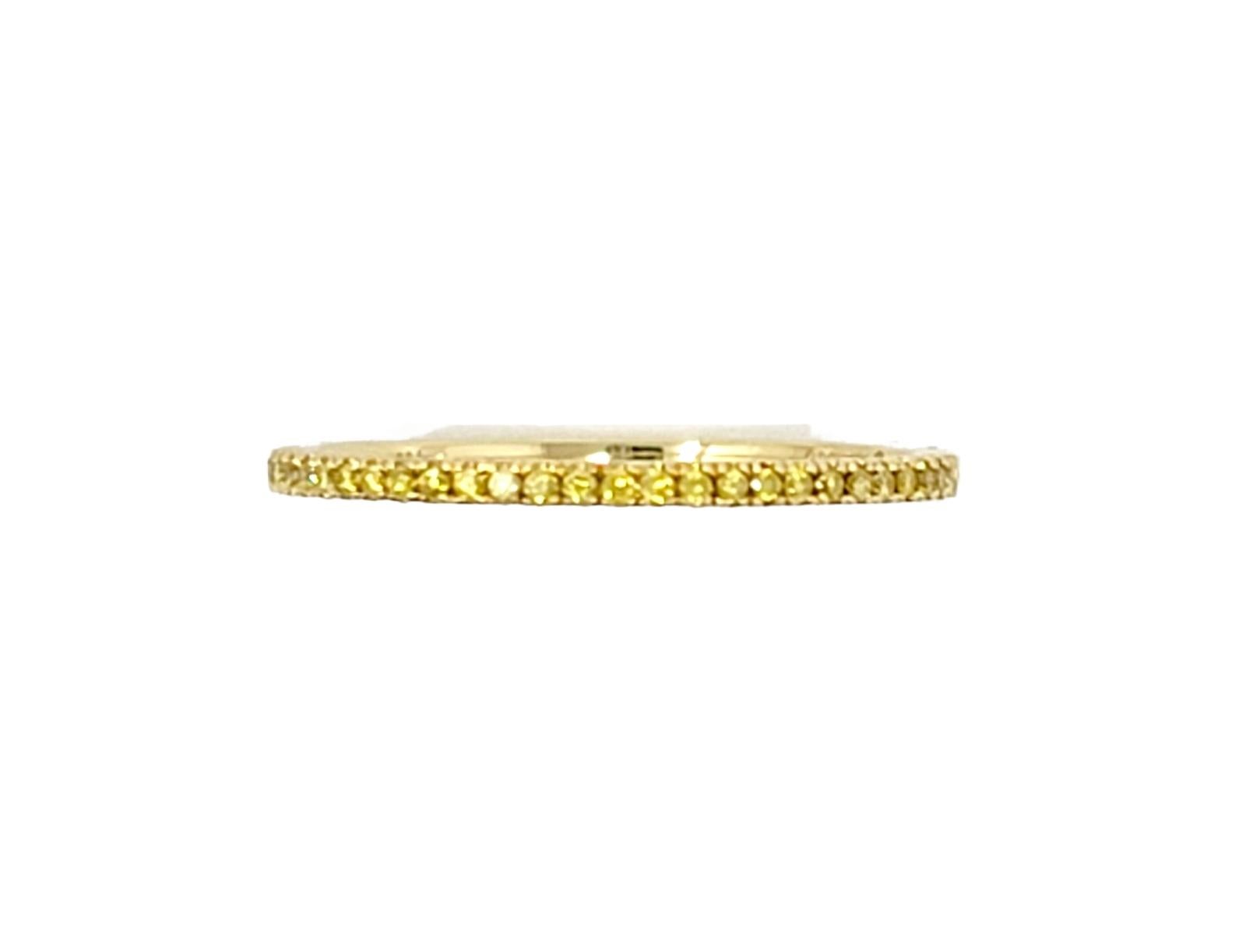 Delicate golden micro-pave yellow diamond semi eternity band ring by Hidalgo offers sleek simplicity and modern elegance. 

Ring size: 6.5
Metal: 18K Yellow Gold
Weight: 1.3 grams
Natural Diamond: .09 ctw
Diamond cut: Round brilliant
Diamond color: