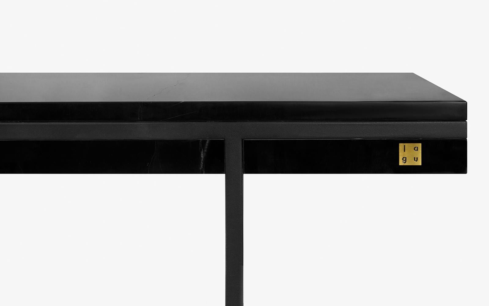 The Hidden sideboard is encased in Black marble highlighted with metal accents, incorporating a simple design.

Materials:
-Alexander black marble
-Black painted metal
-Registered design

Alternatives:
-Light walnut / natural flaxseed oil /