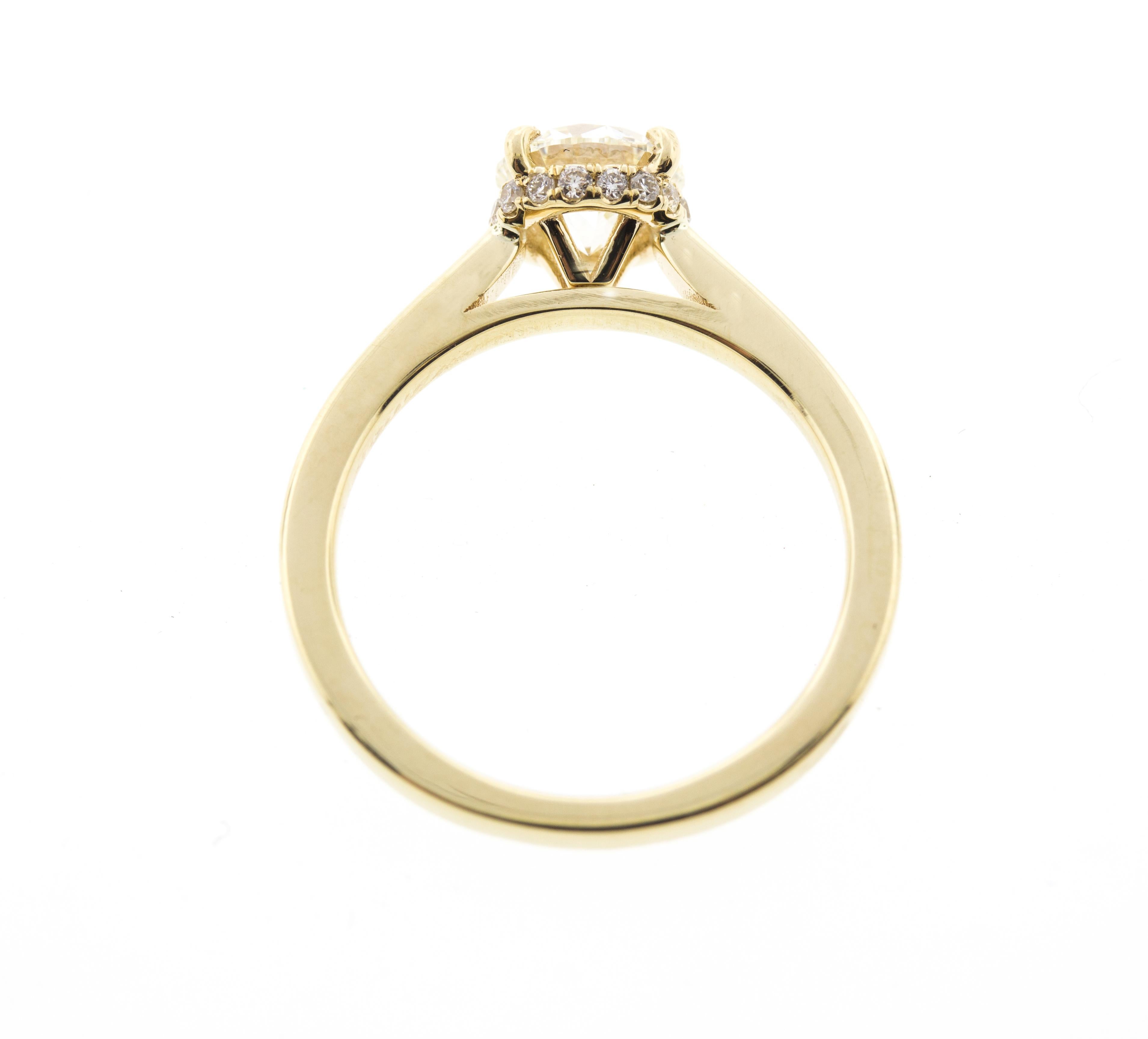 For those of you looking for a unique engagement ring that maintains the simplicity of a solitaire, look no further! 

This ring is crafted in 14k yellow gold and contains a Round Brilliant Cut Diamond (0.80 total carat weight, I color, VS1 clarity)