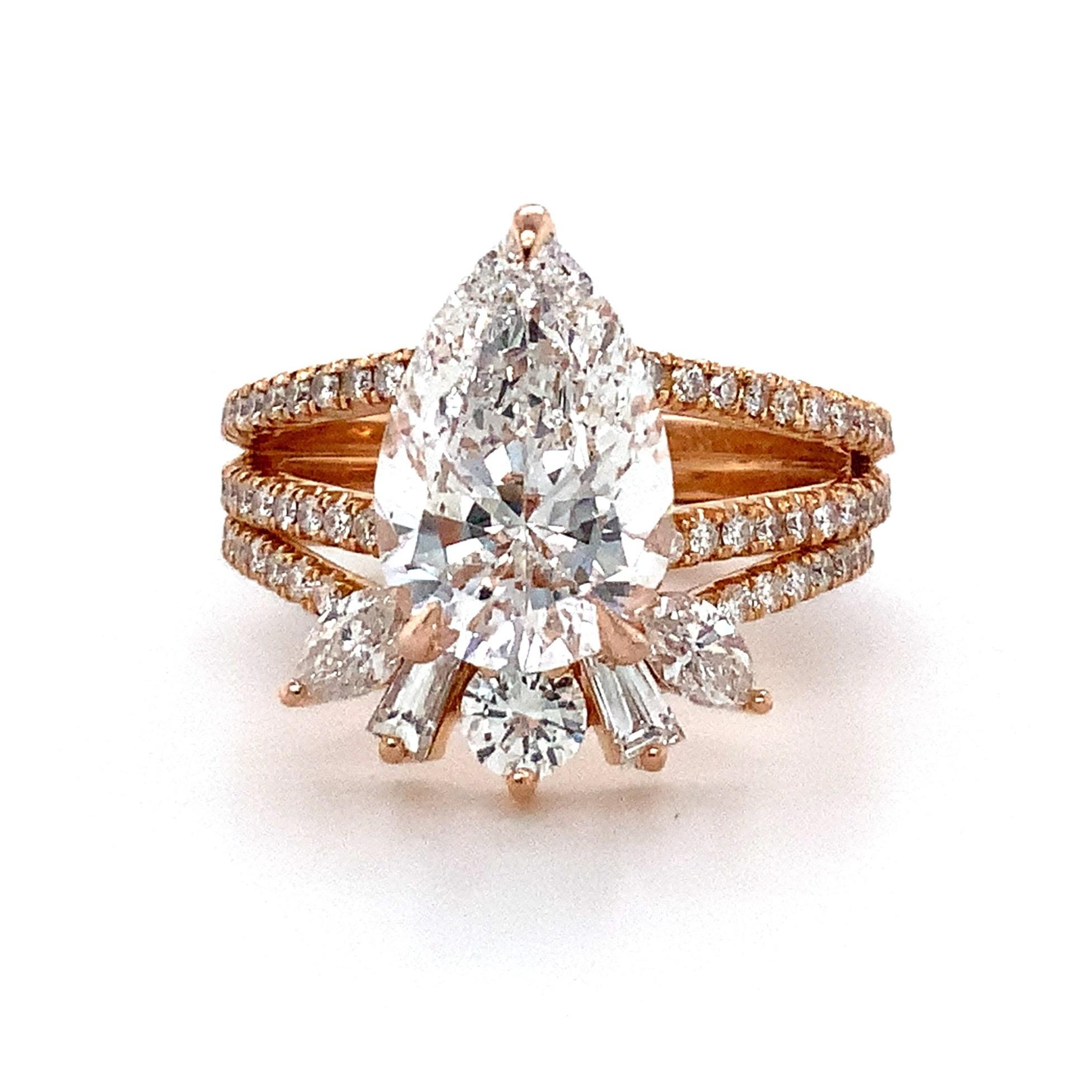 This breathtaking Hidden Halo Split Shank Ring showcases a 2.82 ct. pear-shaped Diamond and comes equipped with a GIA-certified laser inscription and report # 5201547333 (see lab report). With its split shank design and hidden halo, this Ring's