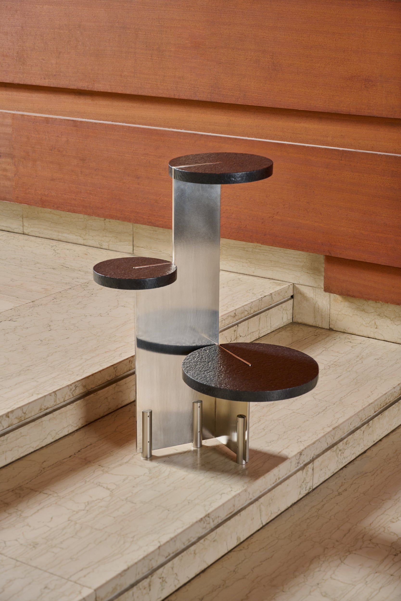 Our designer Multi Level Side Table provides playfulness and tangibility, highlighting the architectural character of the piece of furniture. Adorned in Semi matte Nickle, aged brass or powder coated effect and exuding elegance with granite and