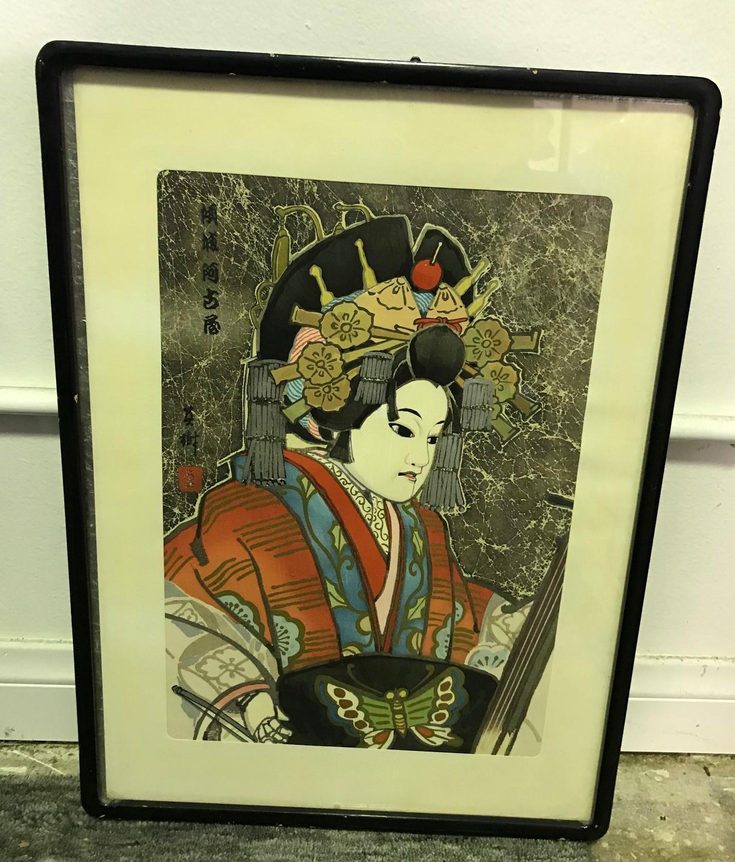 A somewhat rare and hard-to-find image by Japanese artist Masaoka Konobu Hasegawa (though we have also seen this image attributed to artist Hideki Hanafusa but we think this was in error) of a female Bunraku puppet. 

Signed and stamped within the