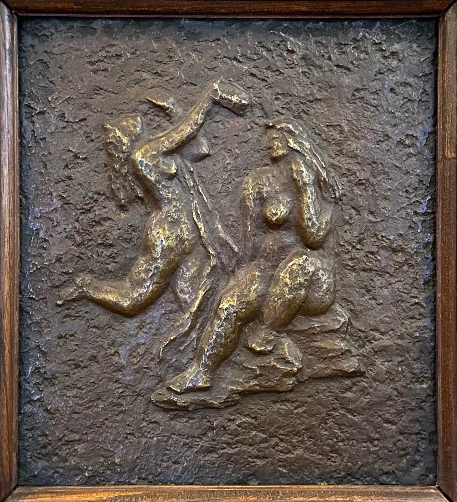 A delightful circa 1940 untitled patinated cast bronze bas-relief wall sculpture by Hideo depicting a pair of bathing women in original elm wood frame.

Classical scene centers on a pair of long-haired and beautifully Rubenesque women on the shore