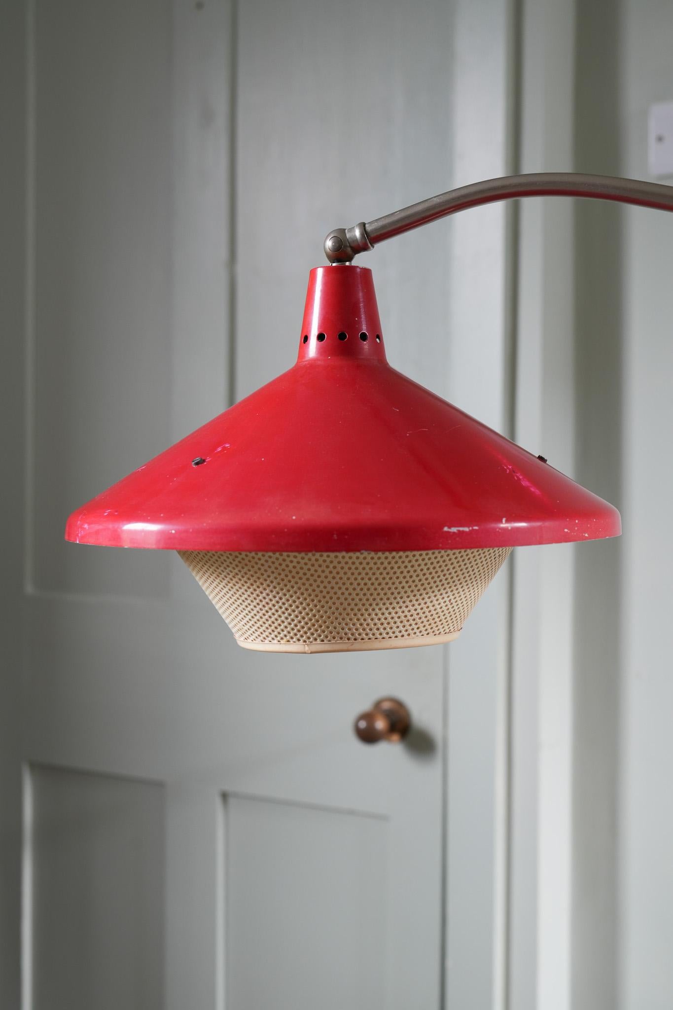 Fifties modernist floor lamp with the design language of Stilnovo & Arteluce.

Painted steel base, adjustable alloy knuckle joint, painted and vented steel shade.

Hiemstra Evolux was a progressive design company located in Amsterdam, founded in