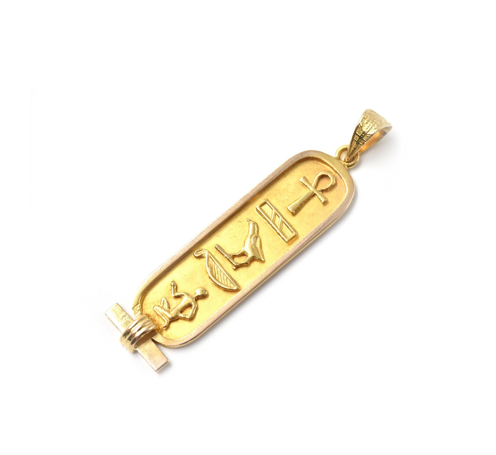 Designer: custom design
Material: 18k yellow gold
Dimensions: pendant is 1 3/4-inch long and 3/8-inch wide
Weight: 3.69 grams

