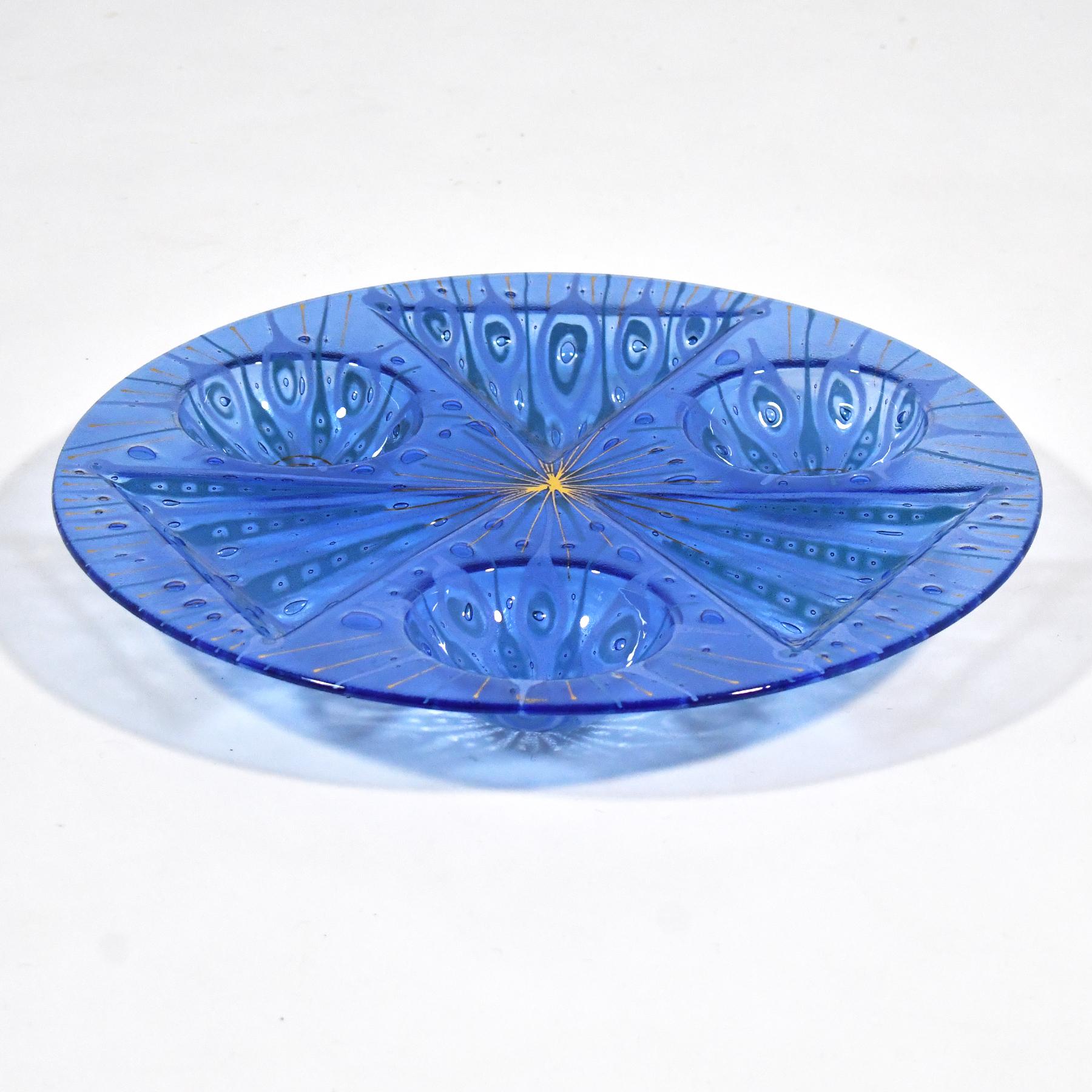 Michael and Frances Higgins’ distinctive designs in fused glass are rich and complex. This large tidbit or snack tray is a terrific example. The vivid peacock blue is accentuated with several layers adding to the visual and physical depth. There are