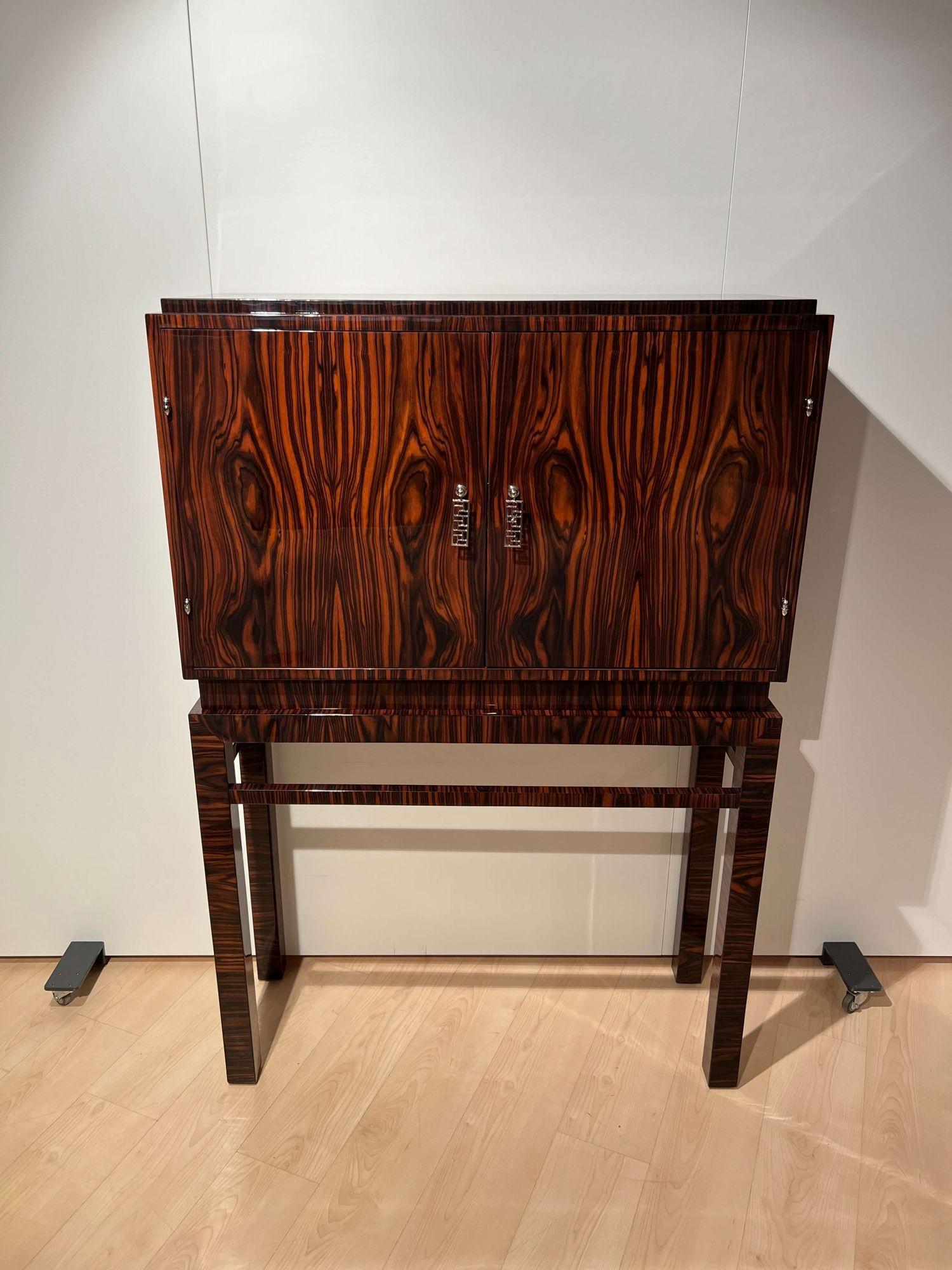 High Art Deco Cabinet, Macassar Veneer, Mahogany, France circa 1930.
 
Beautiful book-matched Macassar ebony veneered. Excellently lacquered with clear piano lacquer and polished to high gloss.
Interior in mahogany with one shelf and 2 drawers.