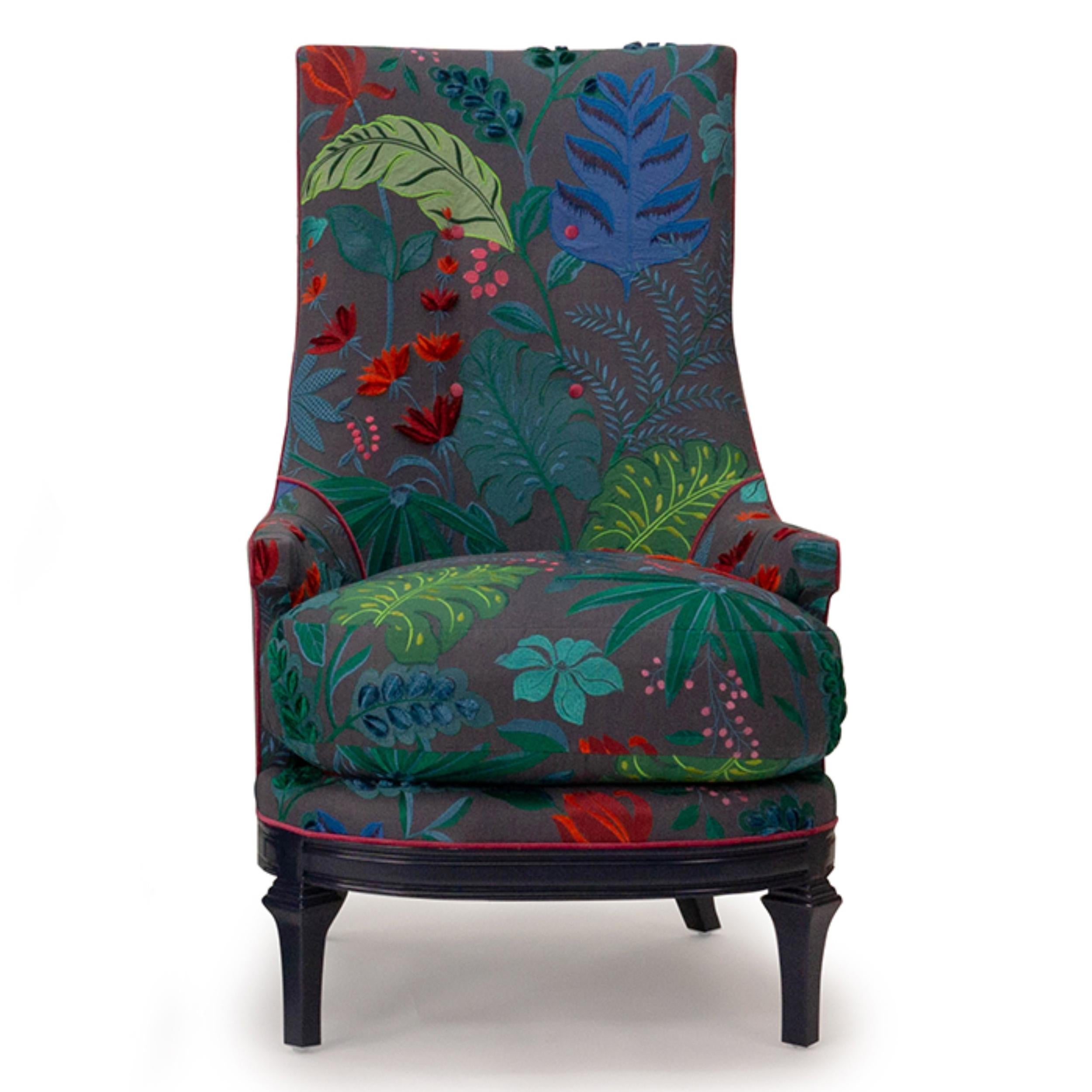 Inspired by classic mid-century style our tea chair has a rounded seat and base and tall back. The chair is shown in Matthew Williamson Cubana/Flordita, a vibrant embroidered linen, with red velvet accent piping and decorative buttons. The deep seat