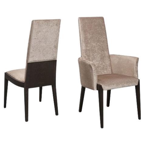 This dining armchair showcases a sleek, modern aesthetic, featuring a robust oak frame that ensures durability and longevity. The upholstery is both stylish and comfortable, designed to complement contemporary interiors. Detailed spruce stitching