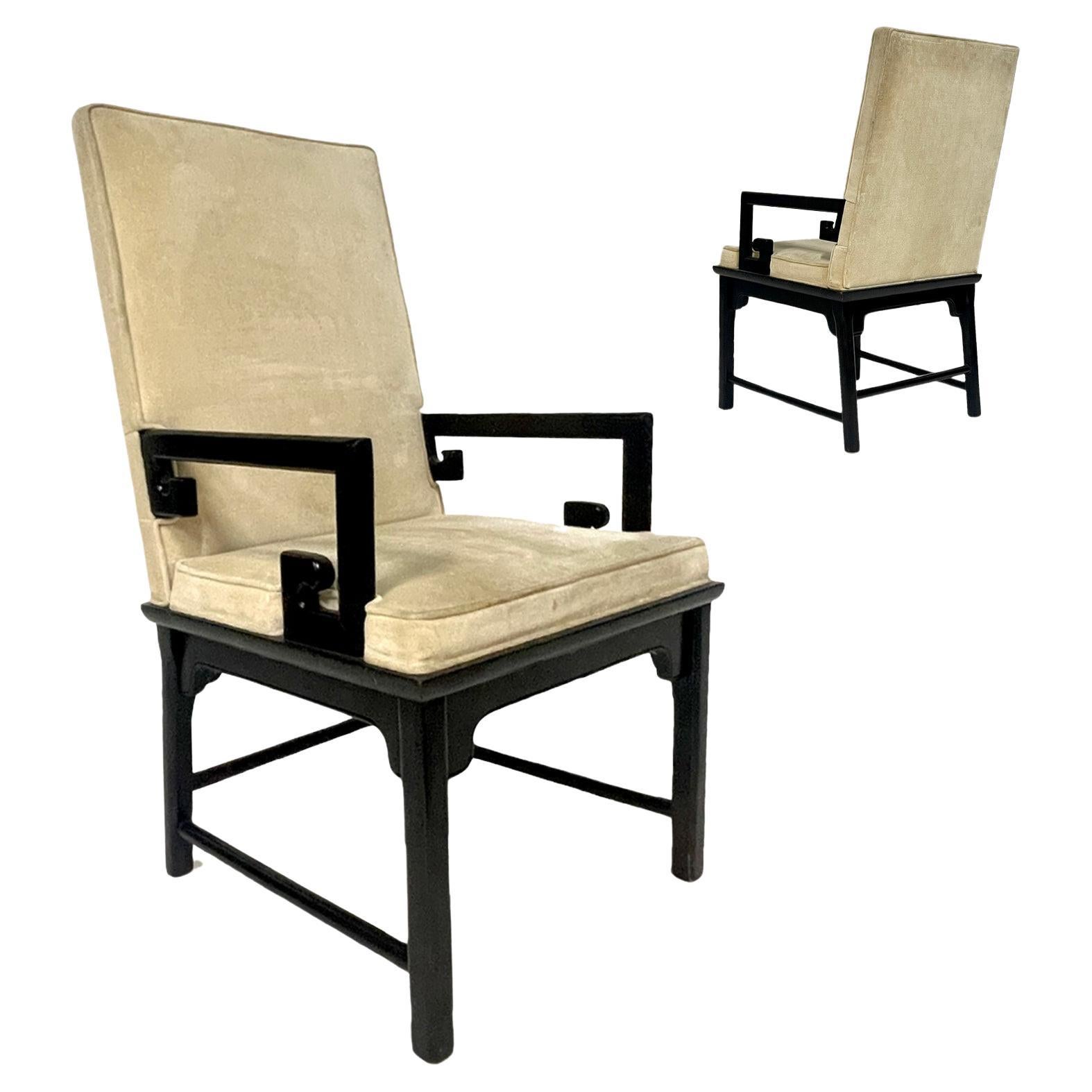 Stunning pair of midcentury Chinoiserie styled chairs in the manner of Michael Taylor. These solid ebonized wood framed chairs w. a cream colored velvet upholstery stand regally. Can be used as armchairs of dining chairs. The upholstery has signs of