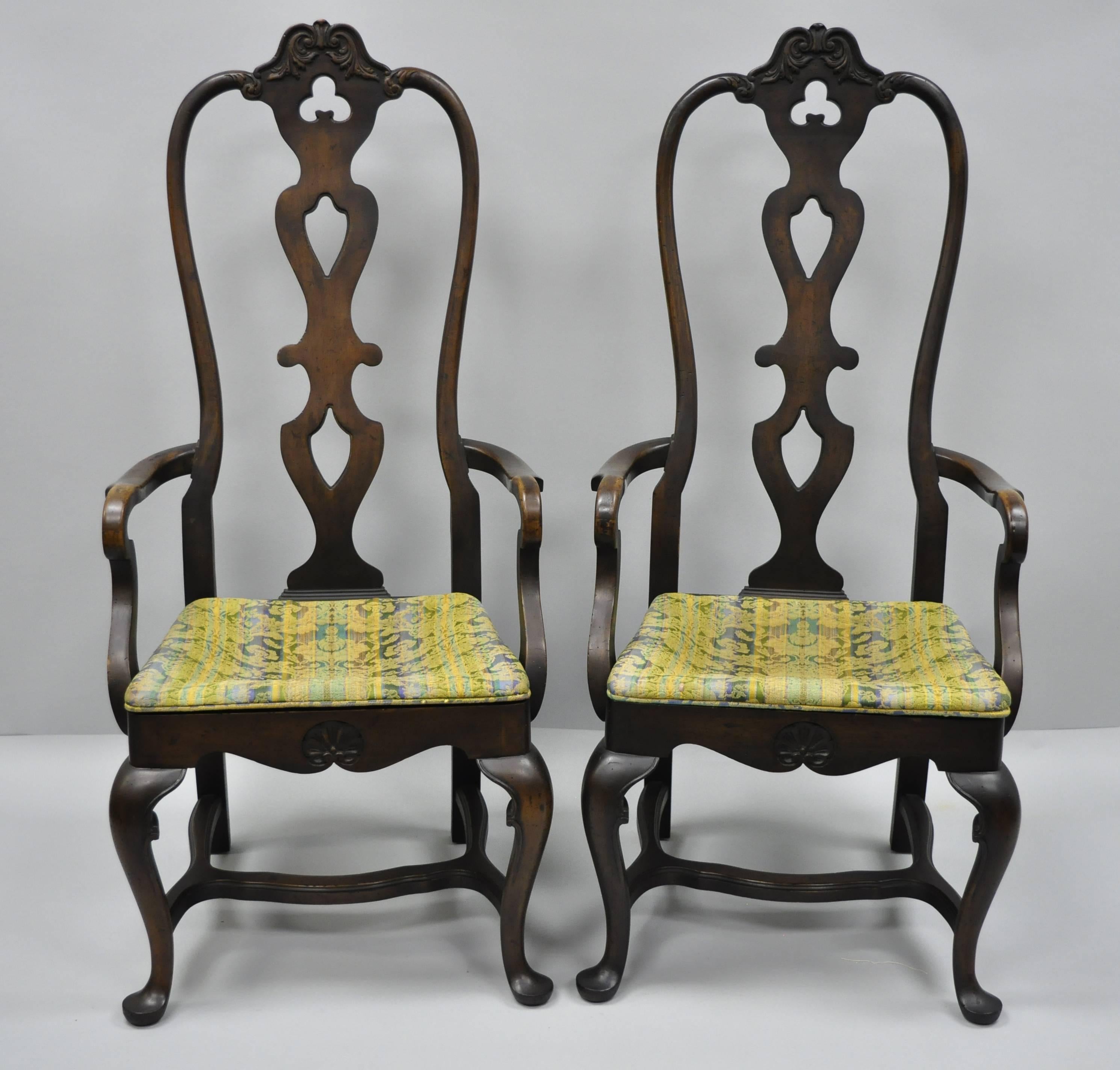 A pair of high back Italian Baroque / Swedish Rococo style dining armchairs by Dods Murdick. Item features tall shapely backs, stretcher base, Queen Anne style legs, solid wood construction, distressed finish, original label, sleek sculptural form,