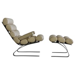 Chaise longue à dossier haut et tabouret de pied par COR:: 1976