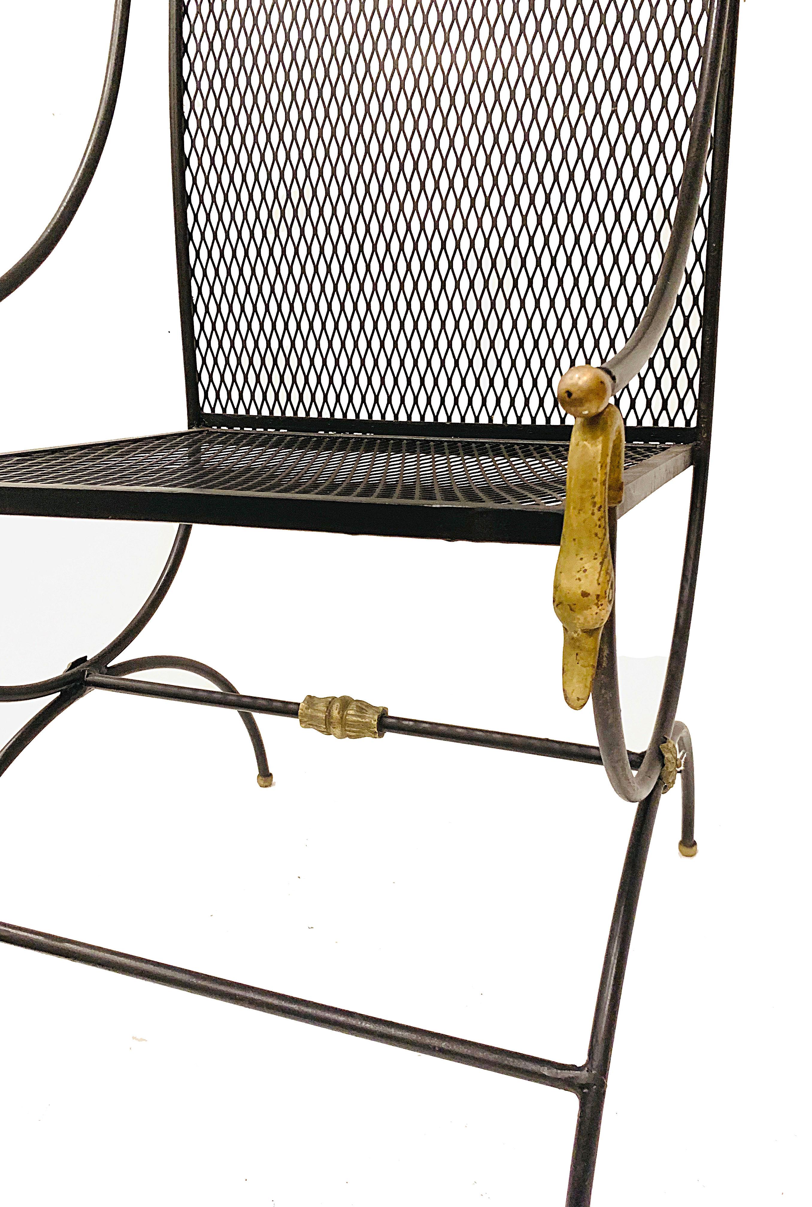 High back metal chair with swan details. Black body and brass swan head ornaments make a nice complement. This chair would look great in a garden, covered porch, as well as indoors.